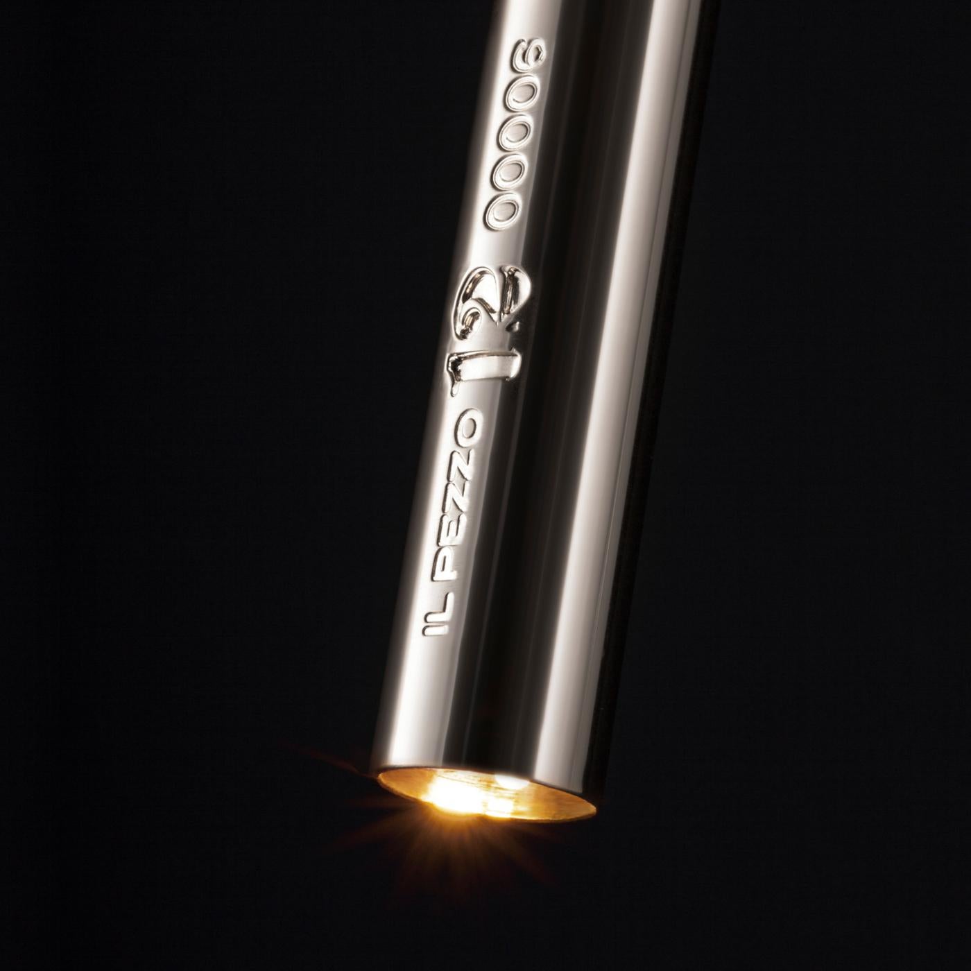 The solid clearest crystal, suspended between brass stems and brass casting rings in nickel finishings, Il Pezzo 12 Wall Sconce creates diffused ambient lighting. At the top and end of each stem, two LEDs spread a warm direct light. Each lamp is