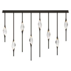 "Il Pezzo 12 Staggered Chandelier" - length 160cm/63” - black and polished brass