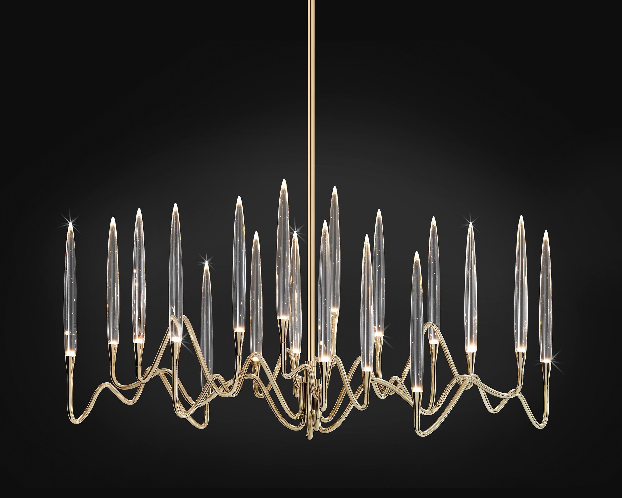 Inspired by Arabic calligraphic art and the icon of the classical candelabrum is Il Pezzo 3, a collection of lamps with a hand-forged brass structure and elegant “candles” crafted from hand blown crystal, according to the noble Tuscan artisan