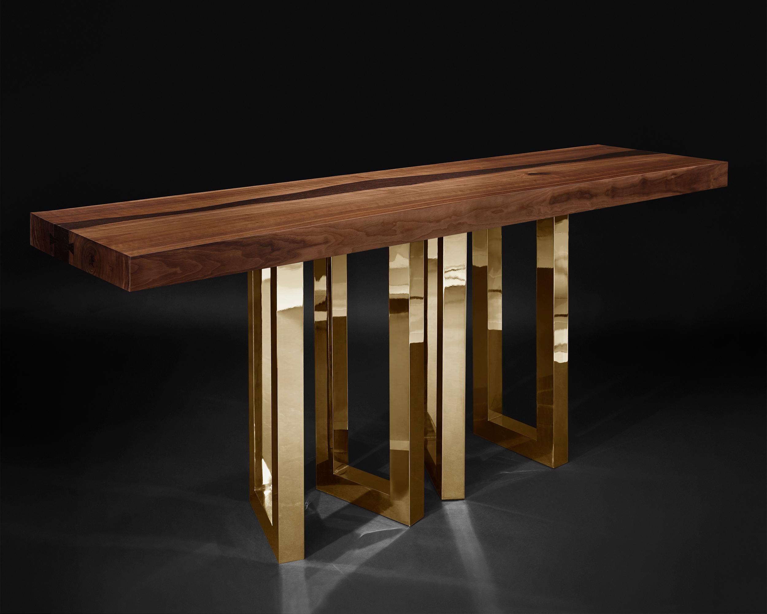 A solid block of walnut held up by what seems to be a casually arranged group of glittering legs. A composite of contrasting elements, massive and sophisticated, strong and passionate; Il Pezzo 6 Console is a harmonious and timeless whole.
The