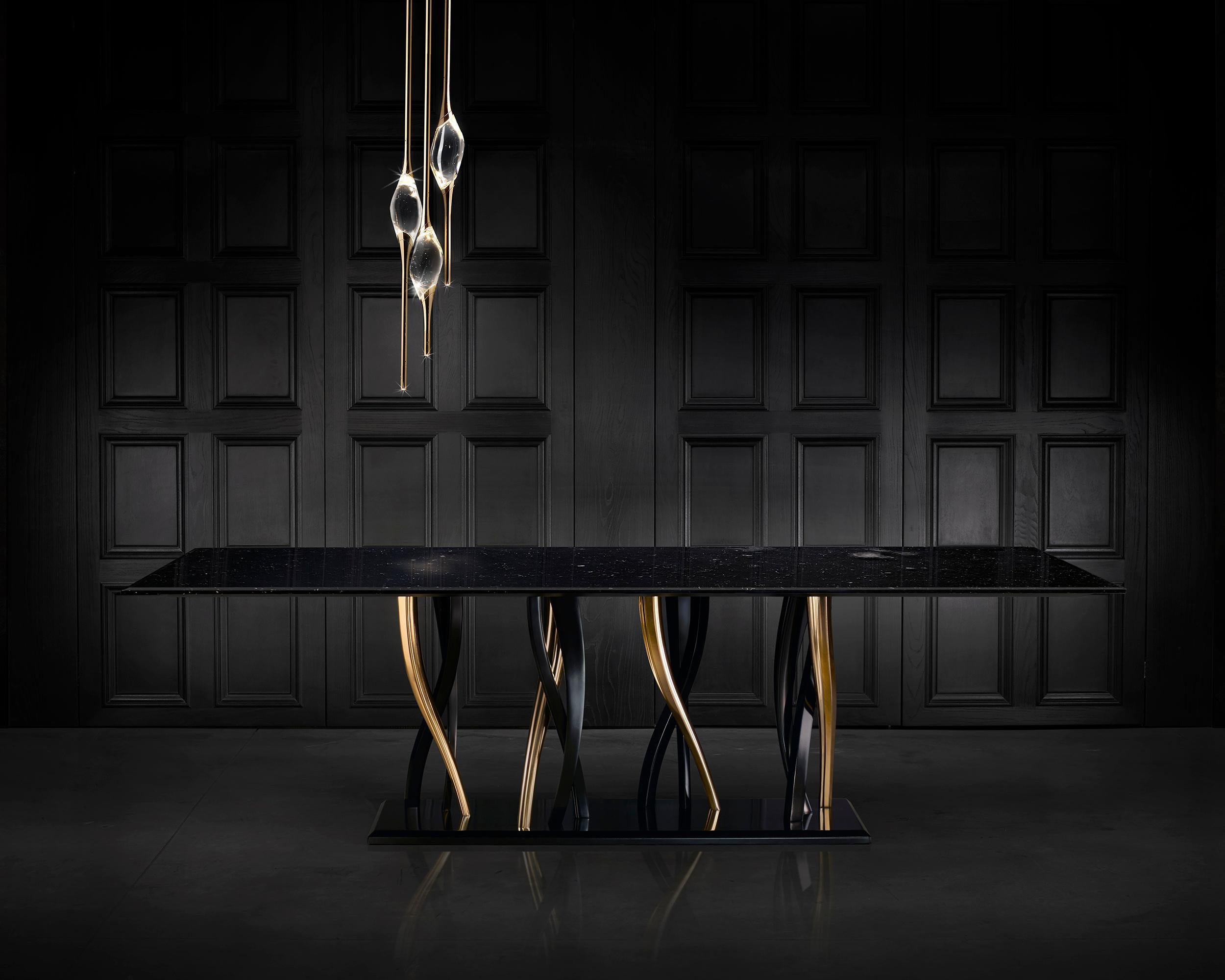 A sparkling forest of legs supports a majestic block of marble. Il Pezzo 8 Marble Table shows its black and gold colors as an eclectic, elegant match you can loose yourself in. It is romantic, sinuous and nimble and at the same time solid, rich and