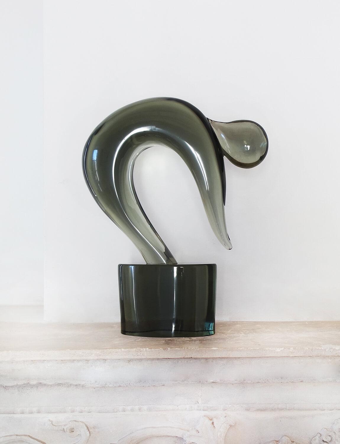 Il Tuffatore is an important hand blown Murano glass sculpture by Loredano Rosin (1936-1992). Il Tuffatore, literally translated as, 'The Diver' is a Murano glass sculpture in deep grey. It depicts a modernist figure with its head down in a diving