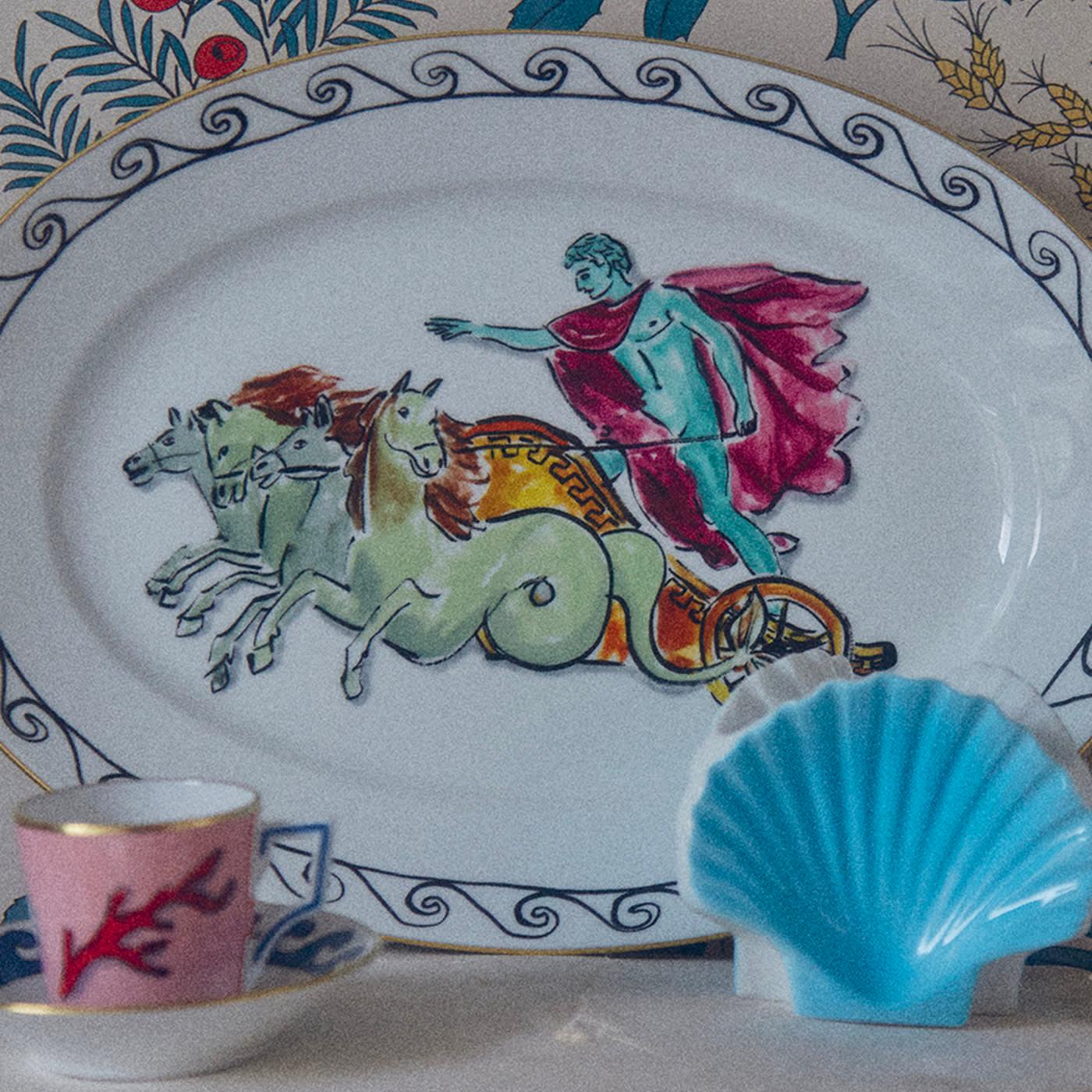 The ancient Roman god of the sea, Neptune, is depicted with vibrant elegance and modern dynamism as he rides a marine-inspired chariot in this elegant interpretation of classical mythology by Luke Edward Hall. The fine porcelain tray becomes art in