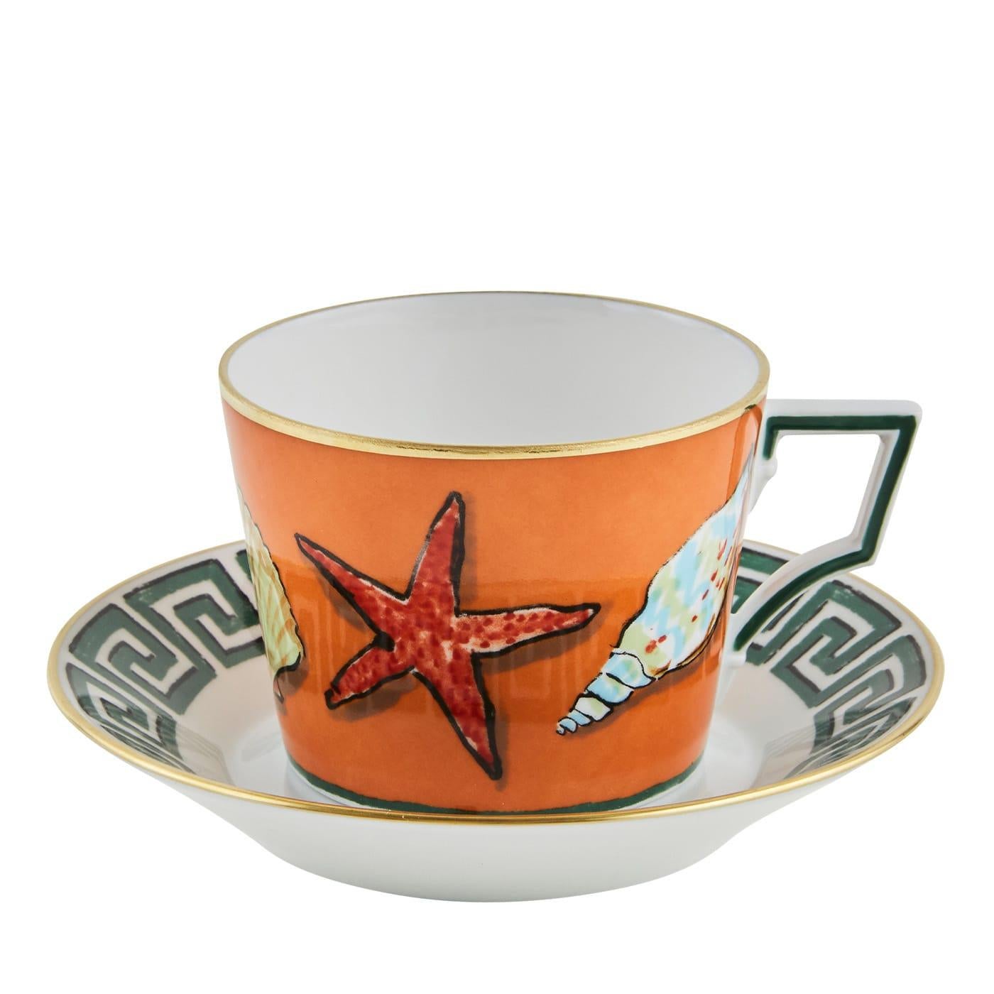 This stunning set of two tea cups and two saucers is a vibrant interpretation of classical elegance by designer Luke Edward Hall. The kingdom of Neptune, the Roman god of the sea, lives in vivid colors and exquisite rendition of marine life on fine