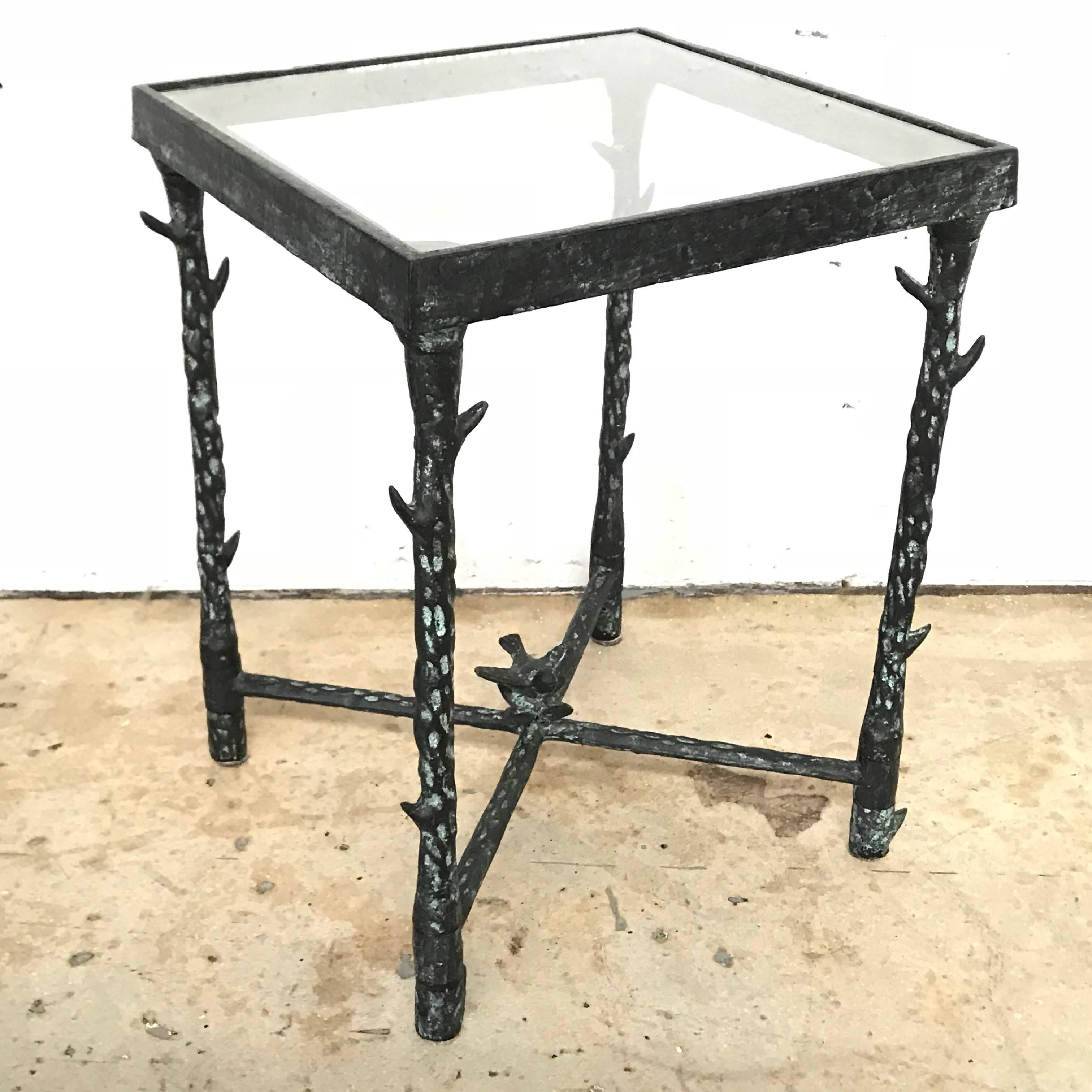 Brutalist table with a faux bois thorn branch frame and flower and bird motif rendered in bronze and glass, designed by Ilana Goor, Israel, 1970s.