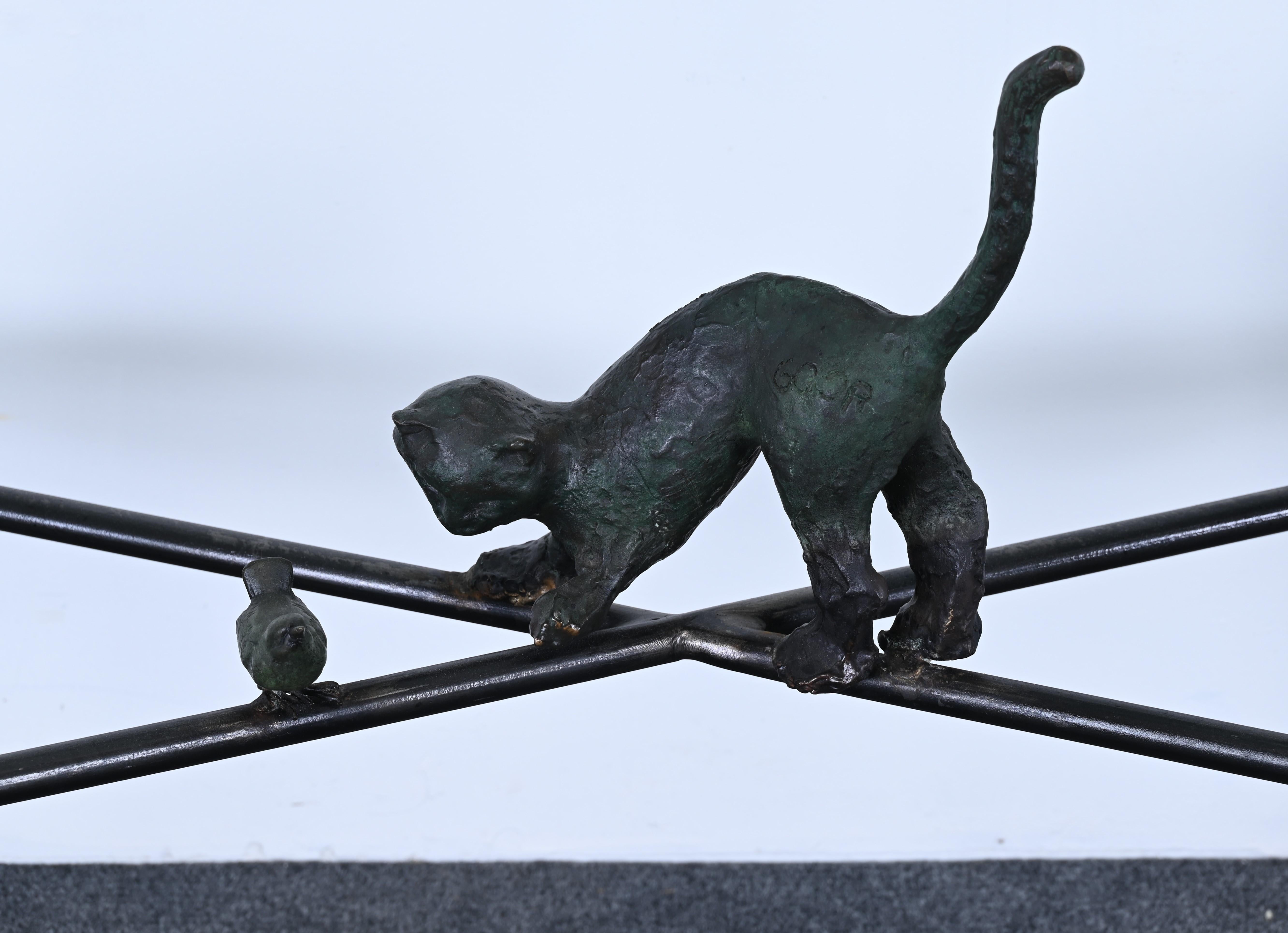 A console table by renowned Israeli artist Ilana Goor (b. 1936), embodying her signature brutalist-organic modern style. Constructed from concrete reinforcing bars (rebar) with a natural verdigris finish, the set features a whimsical bronze cat and