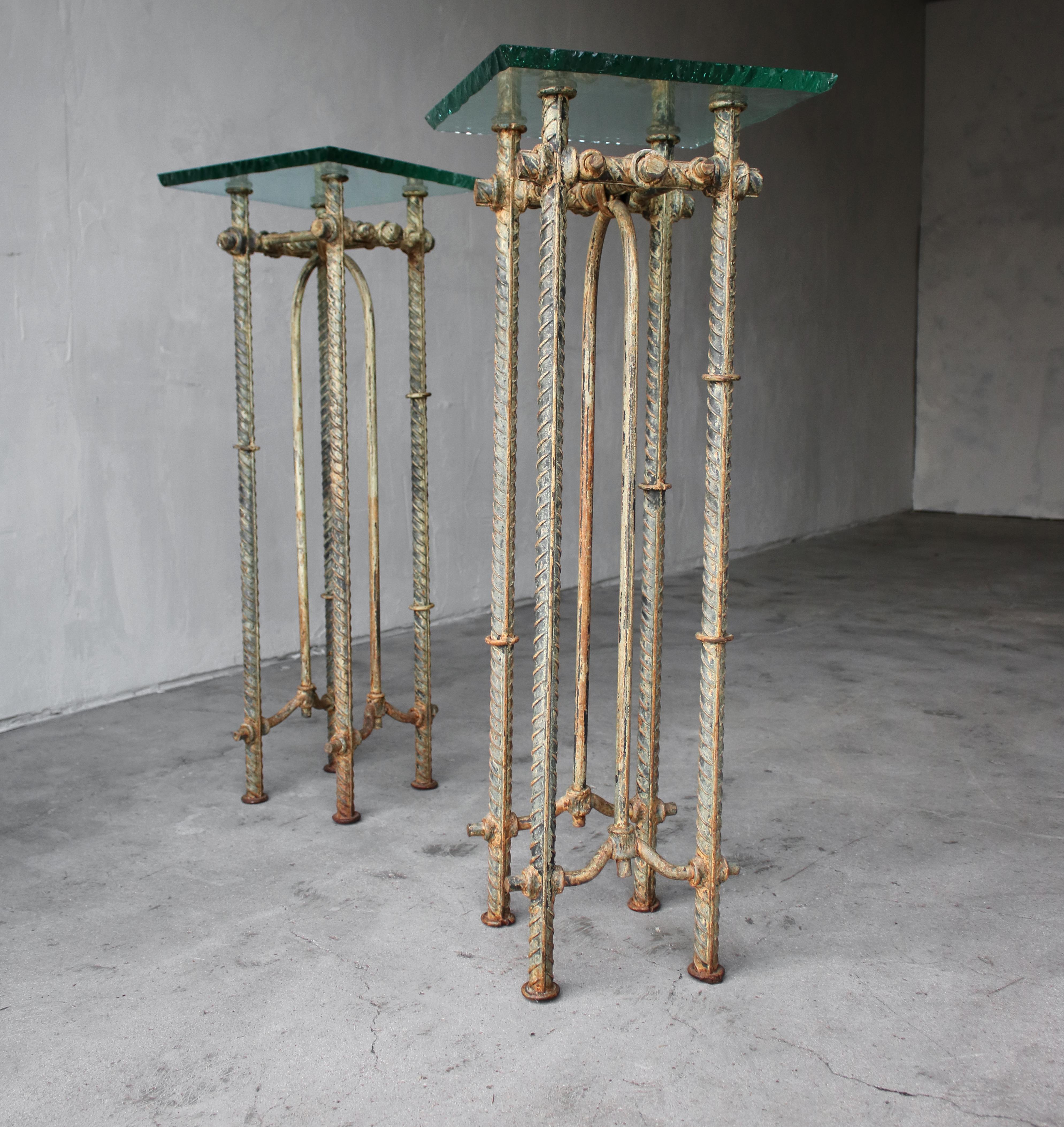 This gorgeous and rarely seen pair of Ilana Goor pedestals is nothing short of amazing. The handwrought frames and rough scalloped edge glass go unexpectedly well together.

Tables are heavy and in excellent condition.