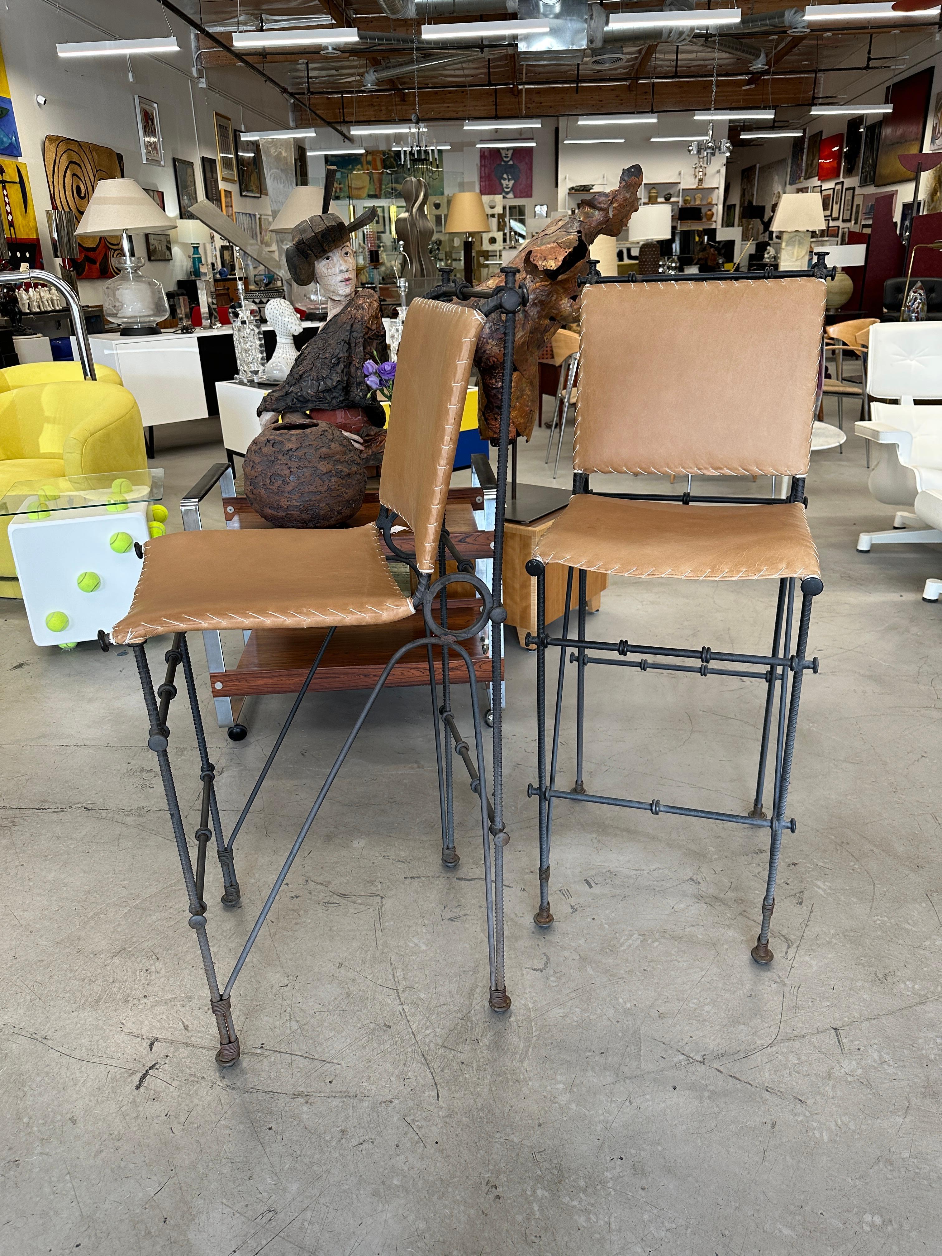 A nice pair iron and leather stools likely designed by Ilana Goor the noted Israeli designer. We’ve had the leather redone in a beautiful slightly distressed leather to match the original. We’ve had our upholsterer meticulously hand stitch the