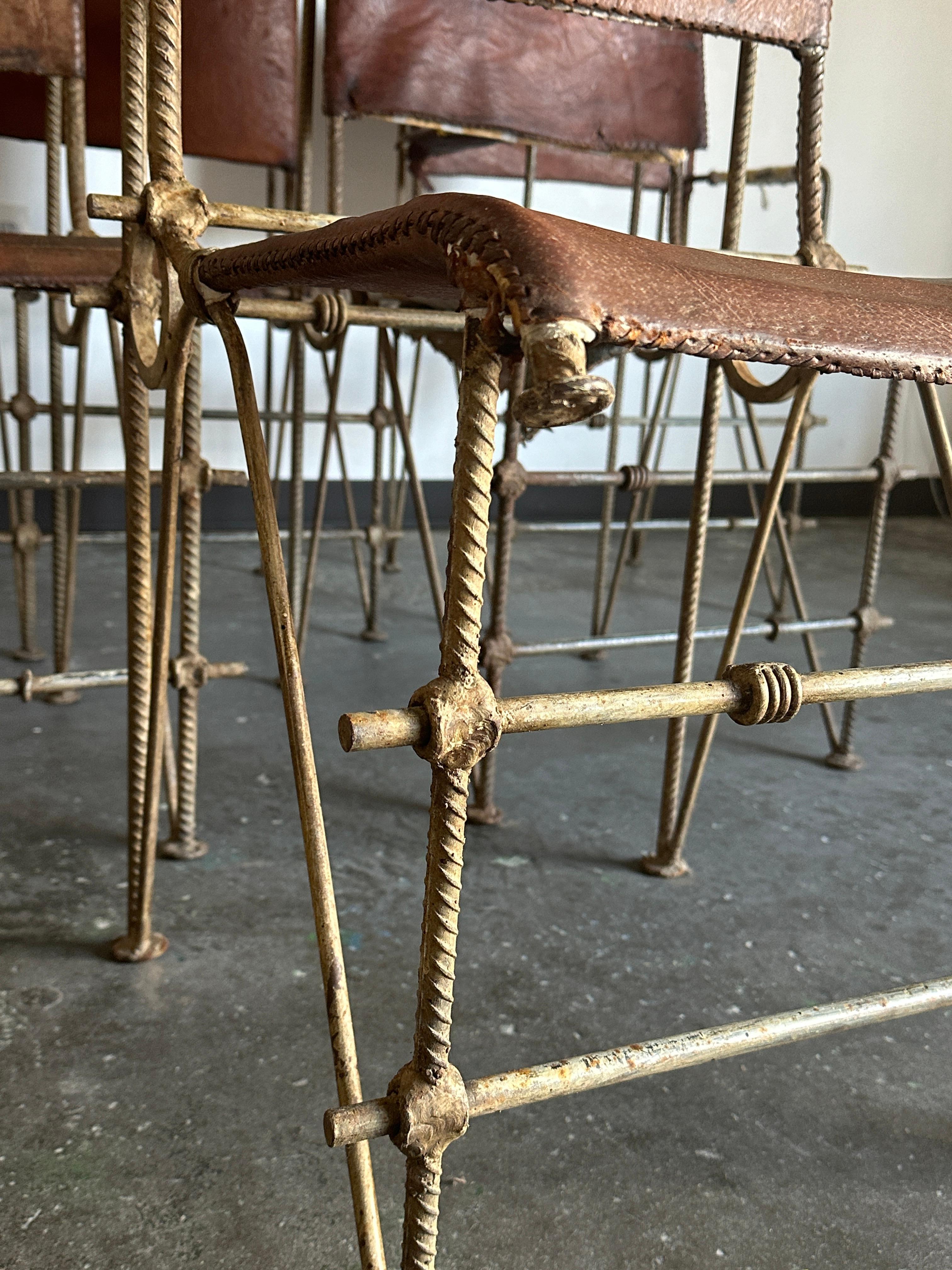 Set of 6 leather and iron chairs attributed to Israeli artist and sculptor Ilana Goor. Set consists of two arm chairs and four chairs without arms. These chairs are comprised of a wrought iron construction with welded joinery, steel rebar, metal