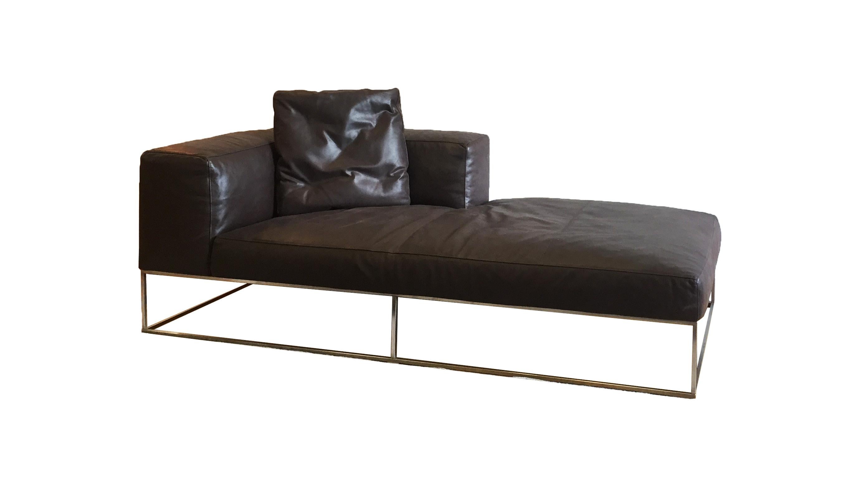Ile Club chaise upholstered in dark brown leather with down-filled cushion and legs in steel. A perfect addition to any living modern living room. Designed by Piero Lissoni in 2007.

Dimensions: 74”W x 37”D x 26”H x SH 14.6”. Showroom sample that