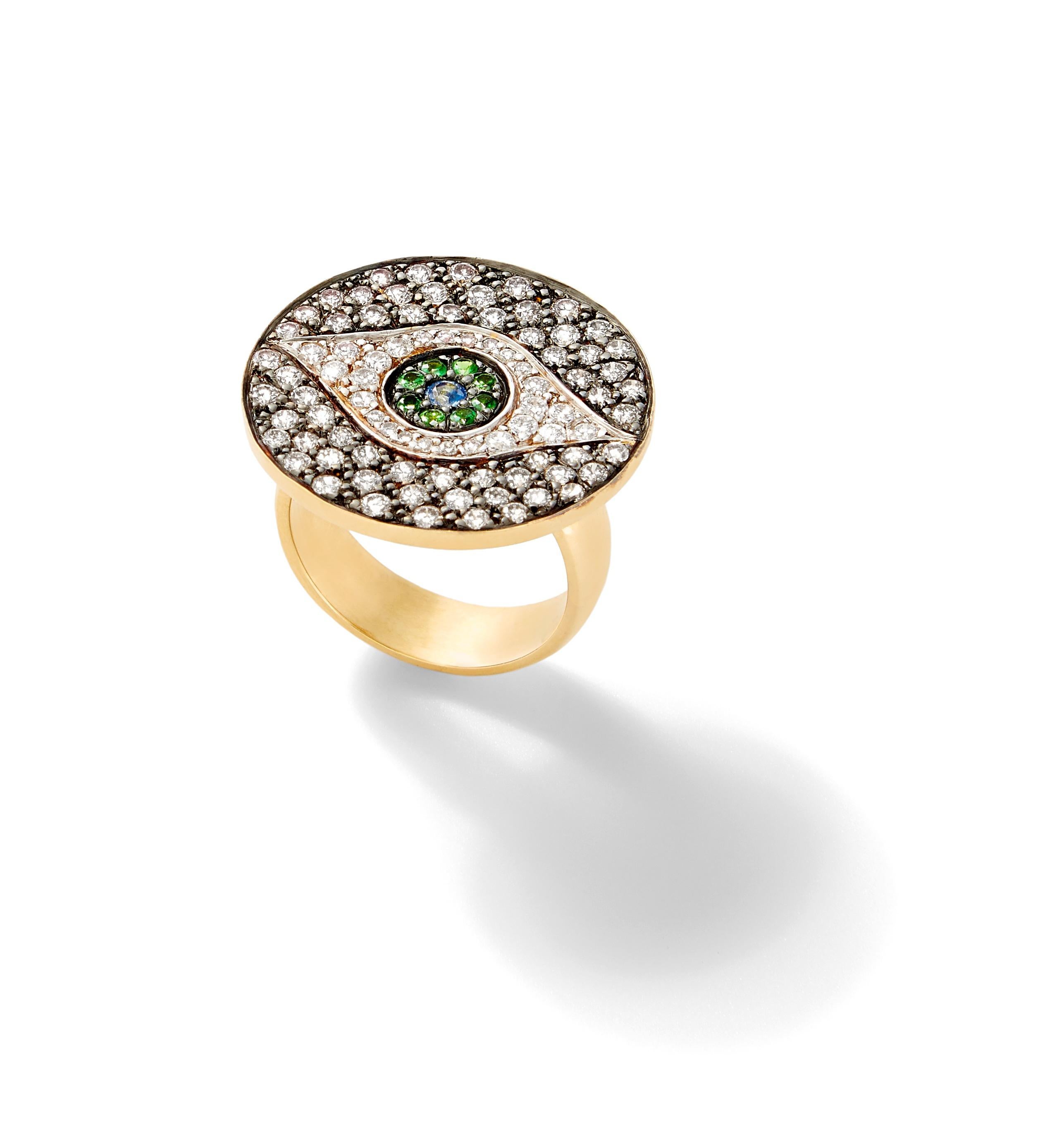 This signature ring of Ileana's called the Dawn ring features her signature Evil Eye which is handcrafted of 18k yellow gold and pave-set with champagne diamonds, white diamonds, tsavorites and blue sapphires.

Dawn eye top feature
Face Dimensions: 