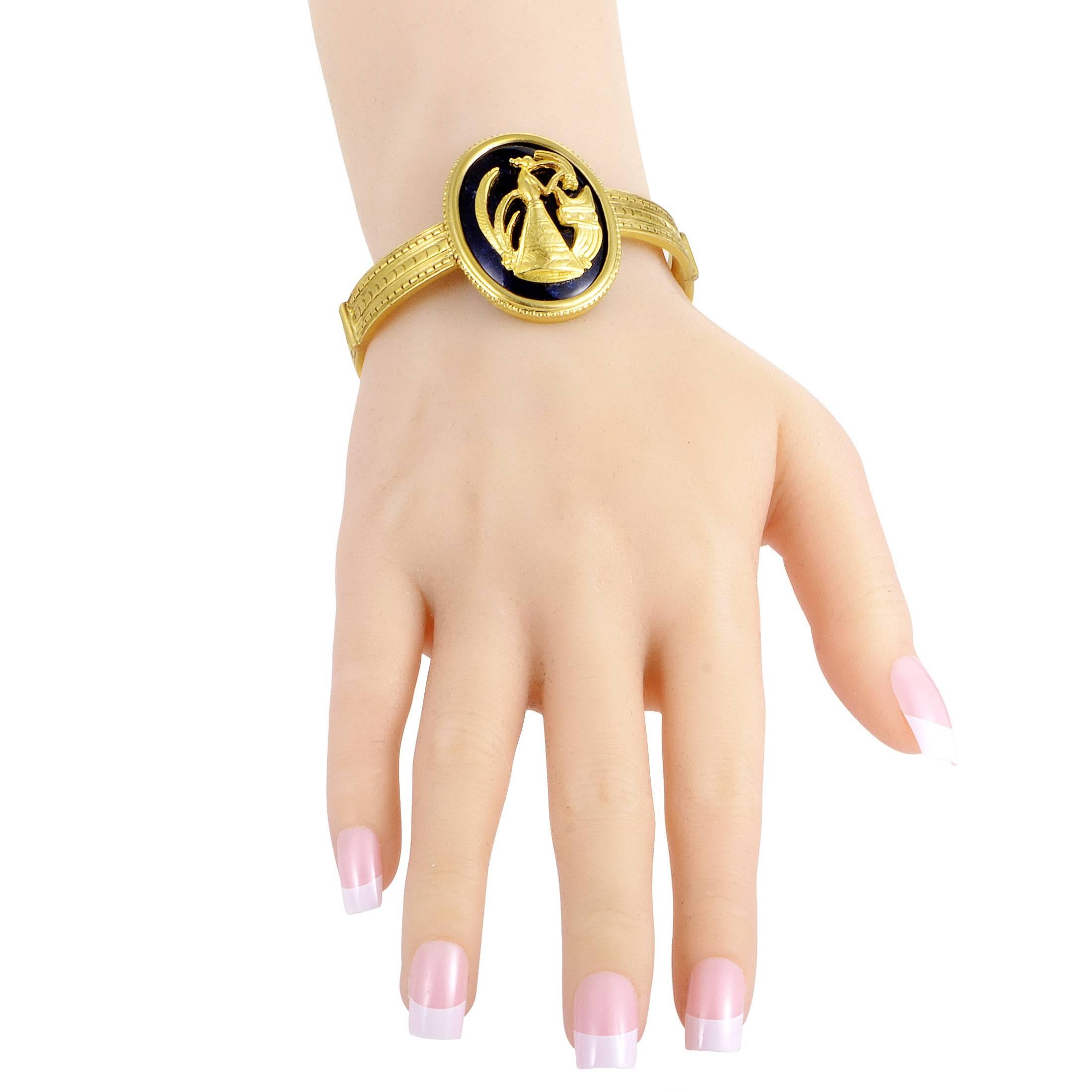 Depicting a wonderful artistic scene in fabulous 18K yellow gold against captivating dark enamel, this gorgeous bracelet from Ilias Lalaounis also boasts compelling ornamentation along its length to produce a classic allure.
Charm Dimensions: 1.5 x