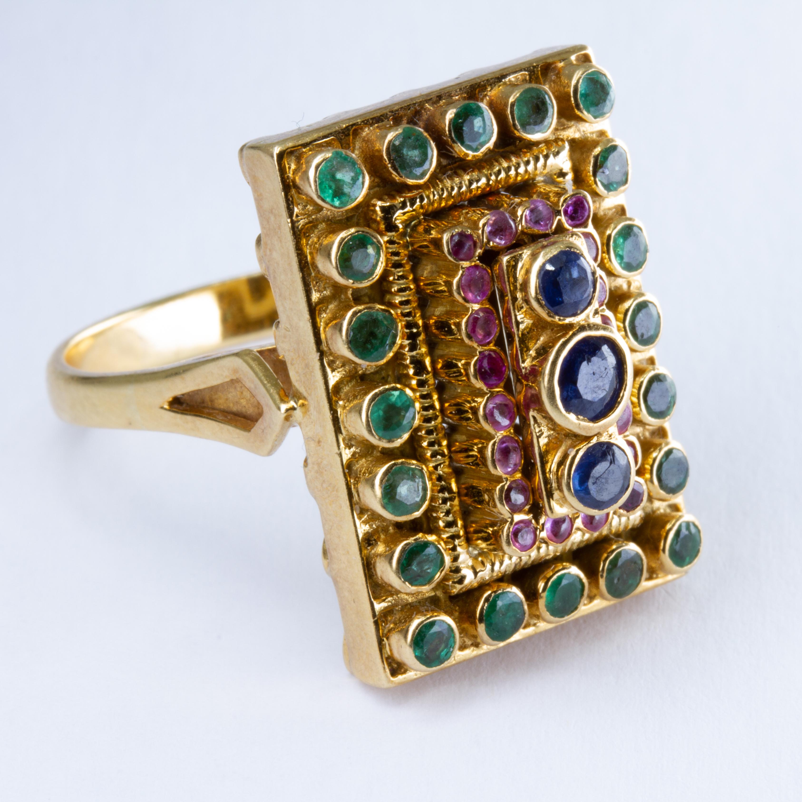 offered is an Ilias Lalaounis 18k Gold, Sapphire, Ruby and Emerald Ring With rubbed signature, marked '750'. Size 8, 9.4 dwts