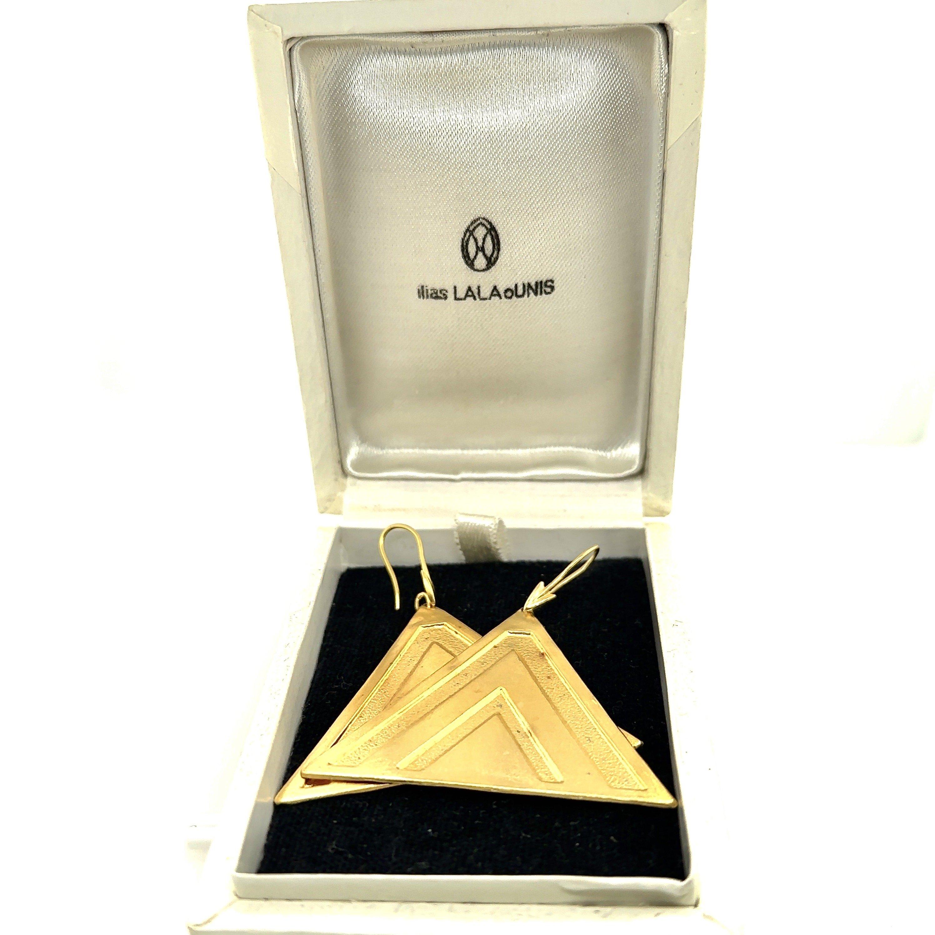 These Ilias Lalaounis Greece Rustic Textured Triangle Dangle Earrings are made of 18KT Yellow Gold. 
The Triangles measure 2