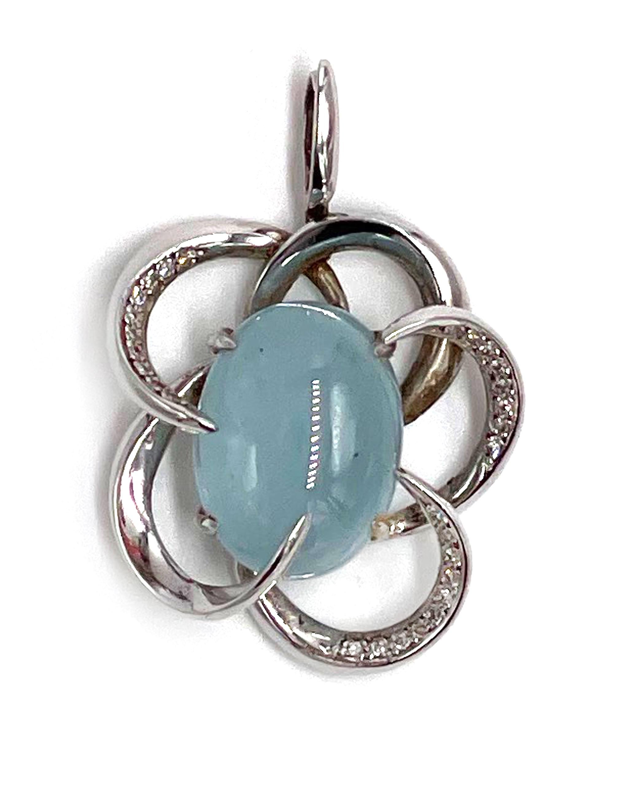 Pre owned vintage estate 18K white gold pendant by Ilias Lalaounis.  The center is set with a 16.22 carat oval cabochon cut milky aquamarine.  The stone has a blue hue, medium tone and vs clarity.  Set on three loops are a total of 28 single cut