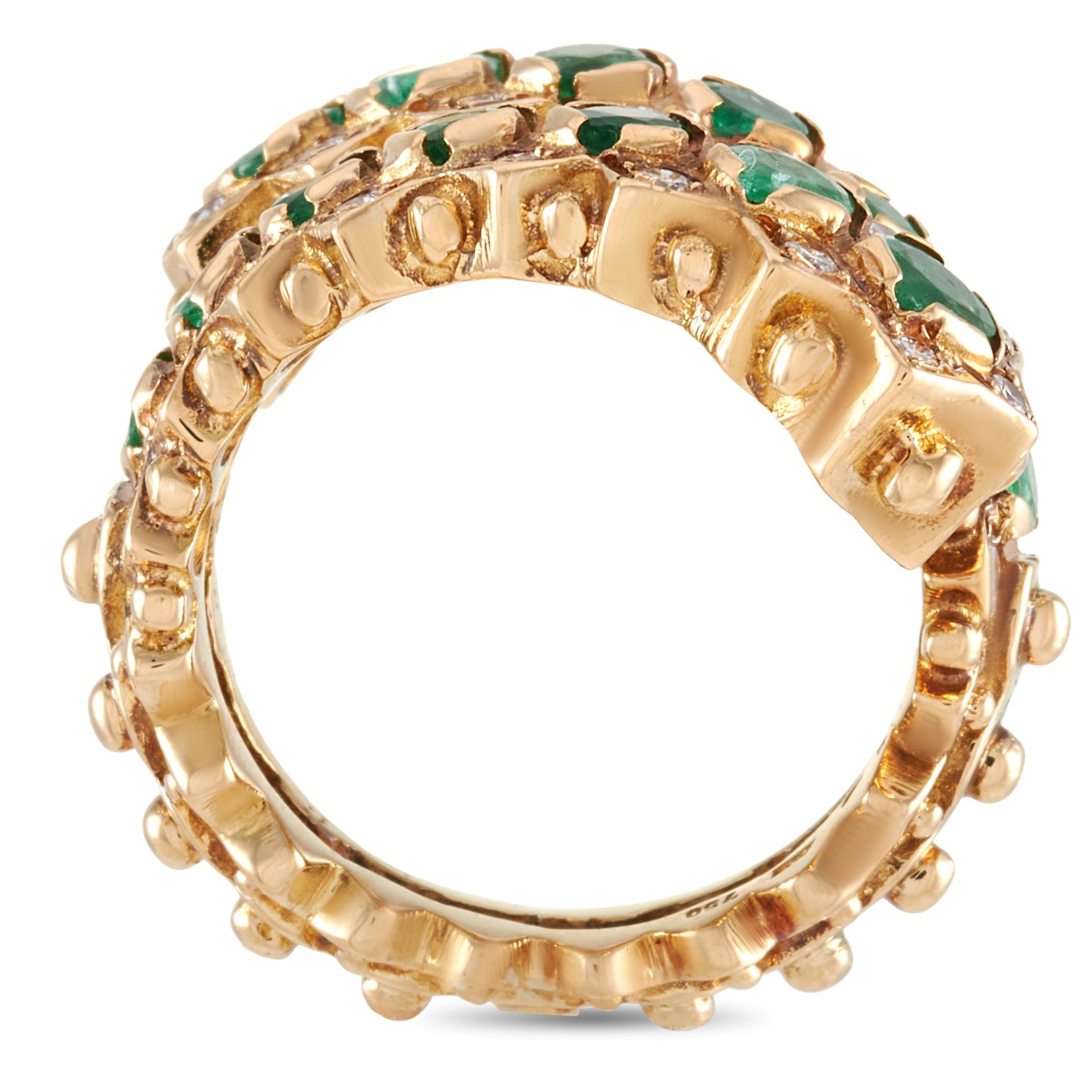 This Ilias Lalaounis ring is crafted from 18K yellow gold and set with emeralds and a total of 0.35 carats of diamonds. The ring weighs 17.9 grams. It boasts band thickness of 6 mm and top height of 4 mm, while top dimensions measure 16 by 20 mm.
