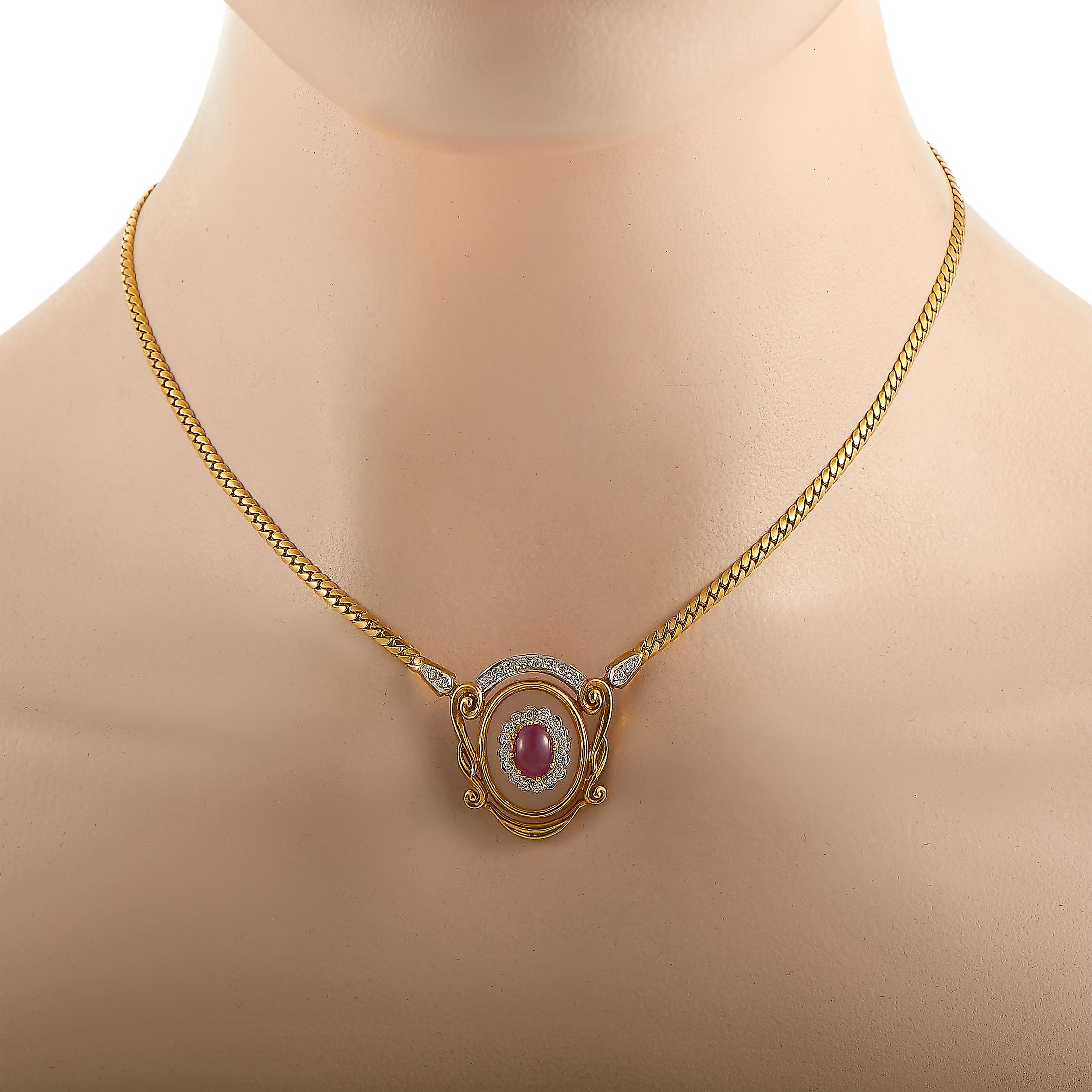 This Ilias Lalaounis necklace is crafted from 18K yellow gold and set with crystal, a 1.30 ct ruby, and a total of 0.50 carats of diamonds. The necklace weighs 22.6 grams and is presented with a 15” chain and a pendant that measures 1” in length and