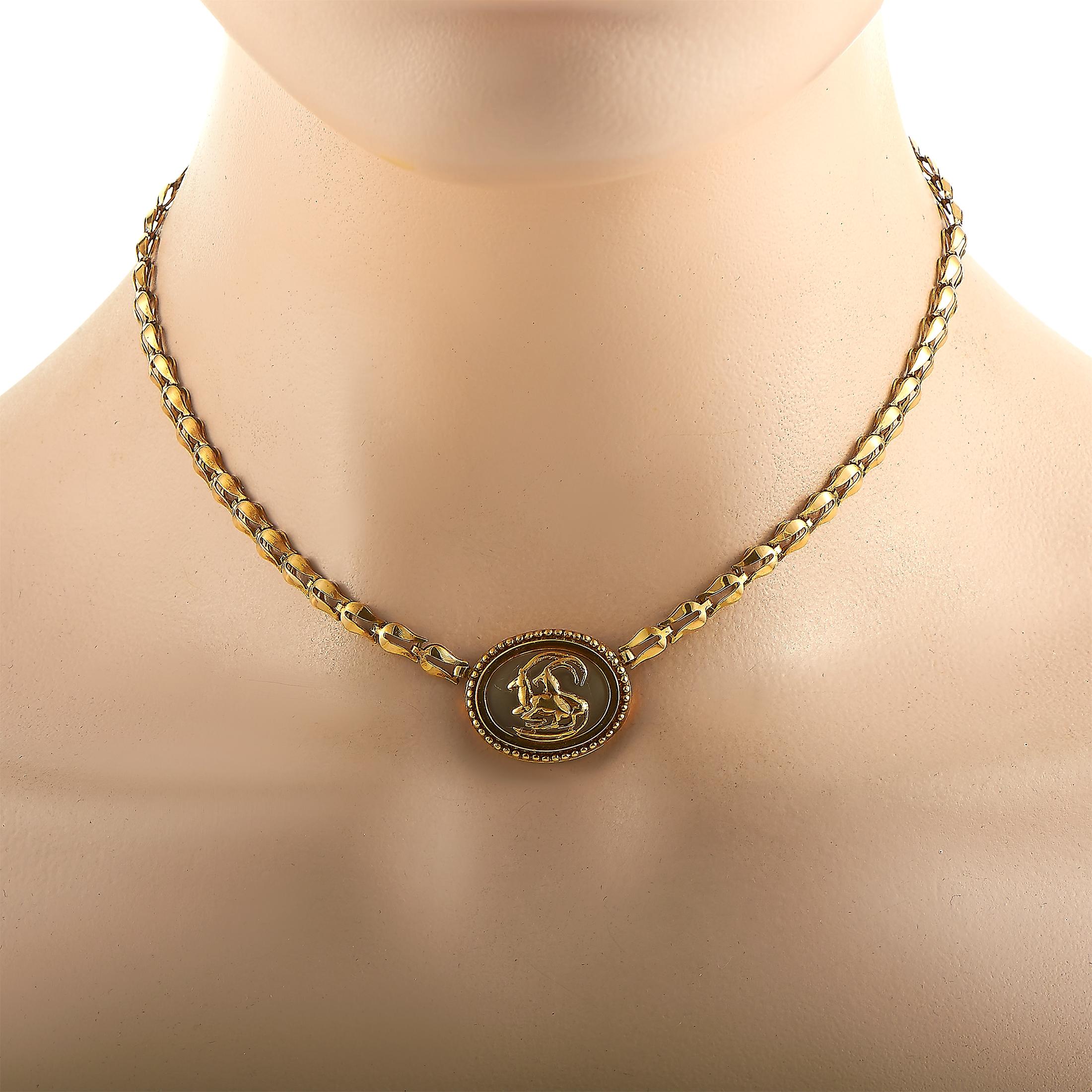 This Ilias Lalaounis necklace is made out of 18K yellow gold and crystal and weighs 20.4 grams. It is presented with a 14” chain onto which a pendant is attached, boasting a wild goats motif and measuring 0.75” in length and 1” in width.
 
 The
