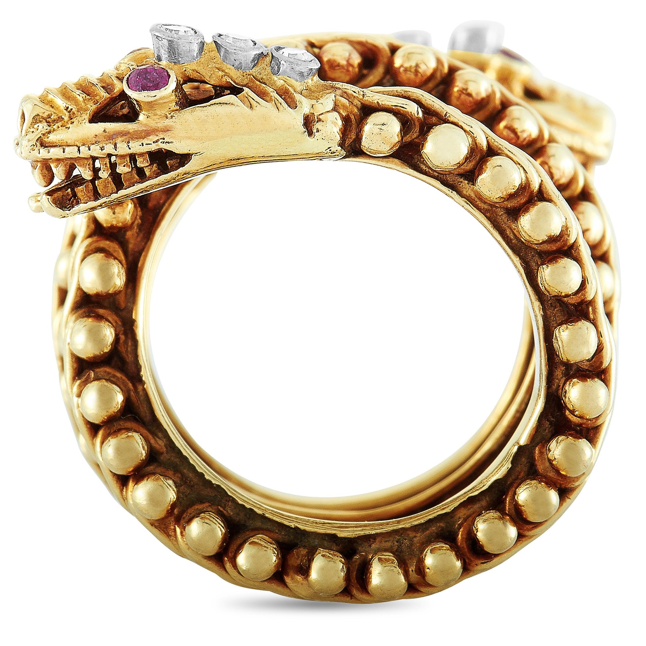 This Ilias Lalaounis snake ring is made of 18K yellow gold and set with diamonds and rubies. The ring boasts band thickness of 22 mm and top height of 5 mm, while top dimensions measure 24 by 35 mm.
 
 Offered in estate condition, this item includes