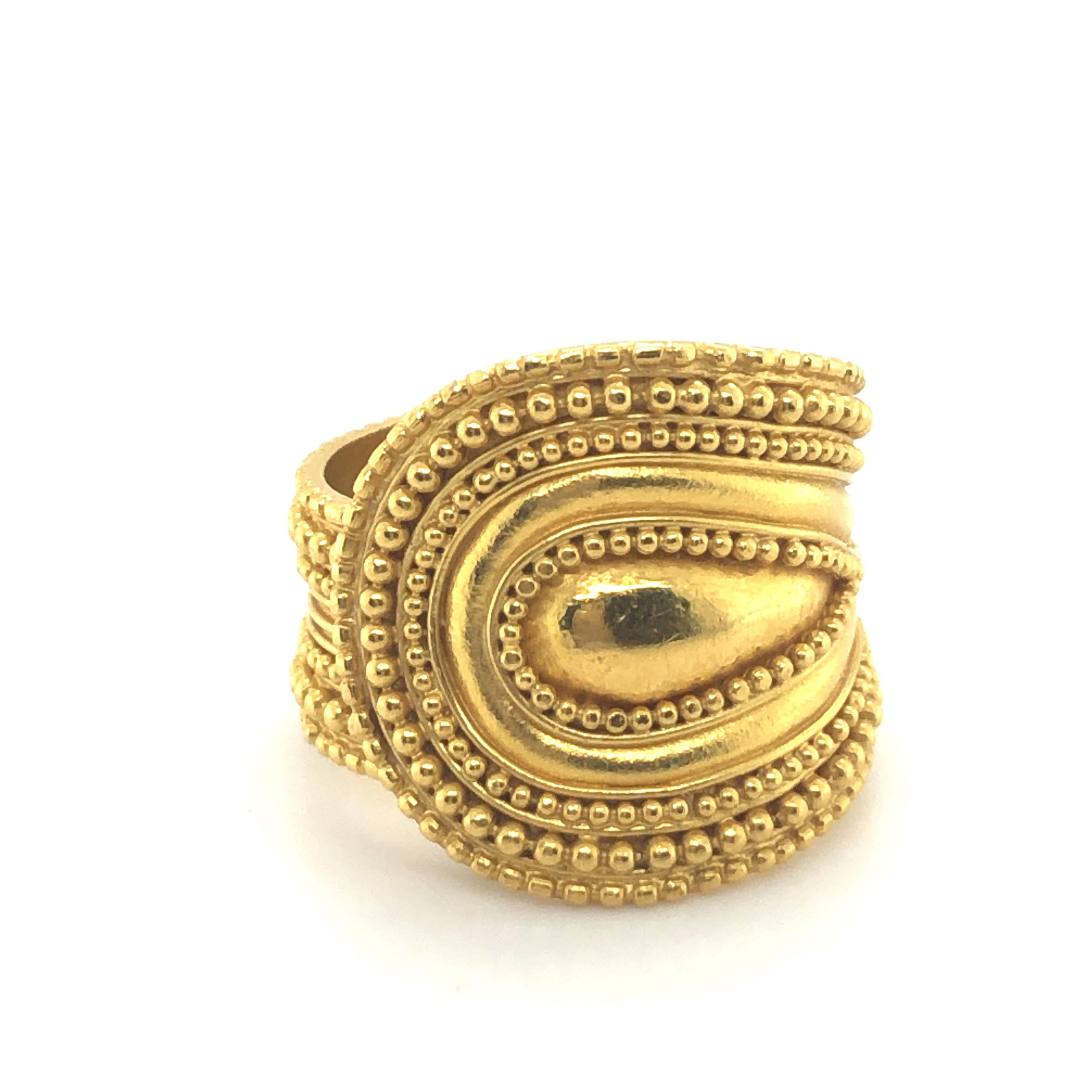 This classic ring by Greek designer Ilias Lalaounis is crafted in 18 karat yellow gold and is accented by beaded and curved lines.

Due to its open design, this ring can easily be adjusted to different sizes.

Maker's mark for Lalaounis, A.8,