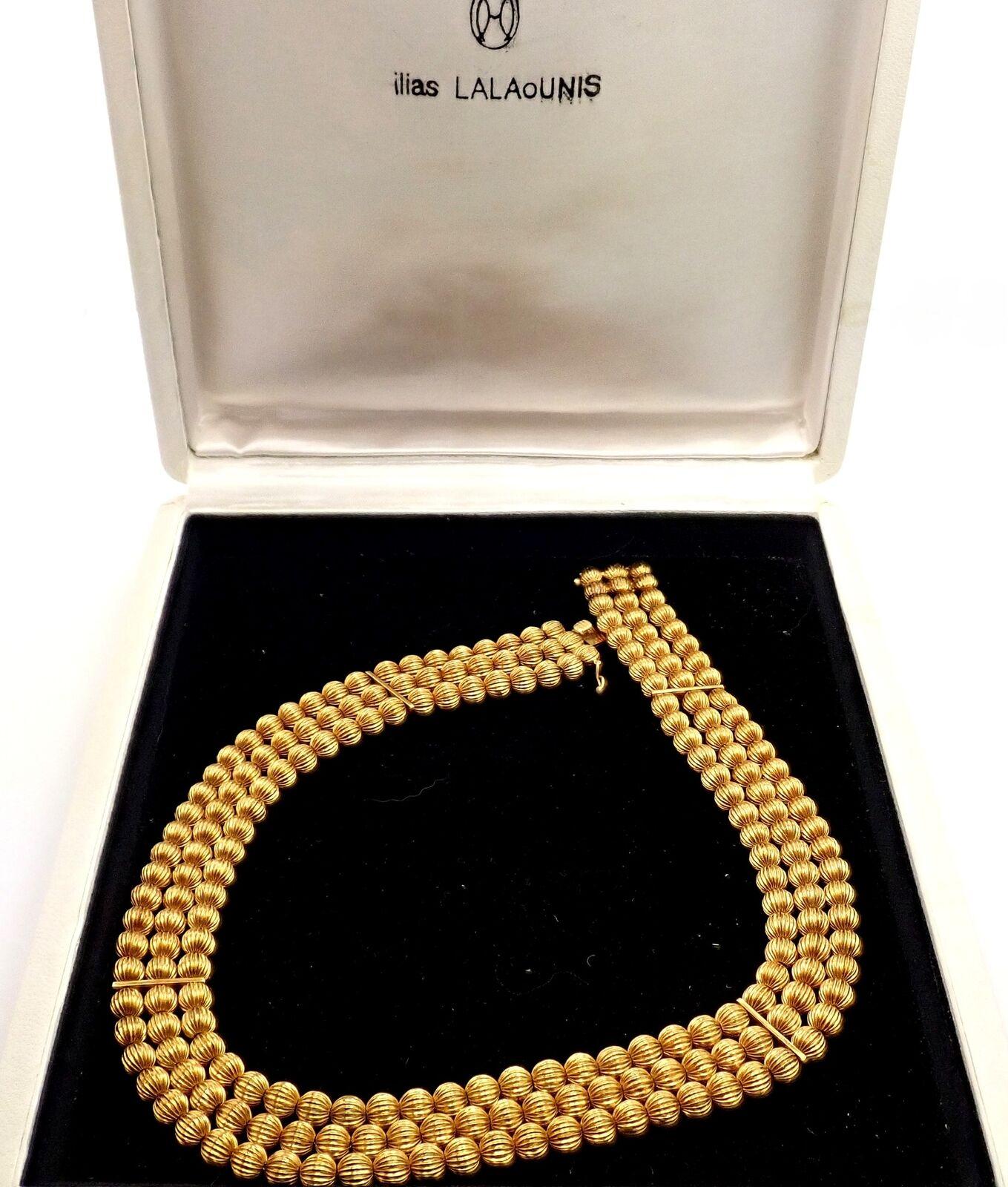 18k Yellow Gold Carved Bead Ball Necklace by Ilias Lalaounis Greece.
Details: 
Length 16