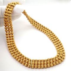 Collana Ilias Lalaounis con sfere di perle intagliate in oro giallo