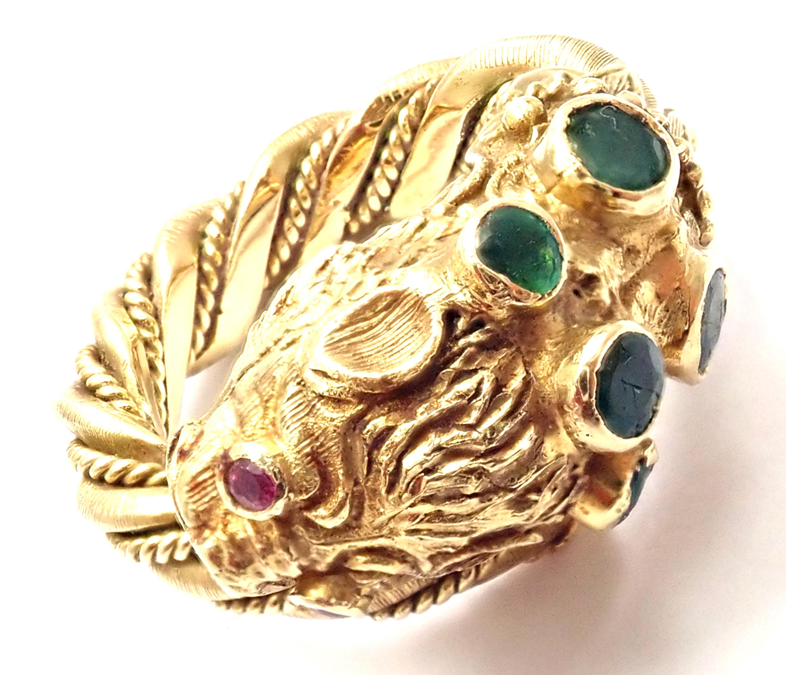Vintage 18k Yellow Gold Emerald & Ruby Chimera Ring by Ilias Lalaounis. 
With 5 round emeralds
2 round rubies in the eyes
Details: 
Ring Size: 3.5
Weight: 16 grams
Stamped Hallmarks: Lalaounis A21 750
*Free Shipping within the United States*
YOUR