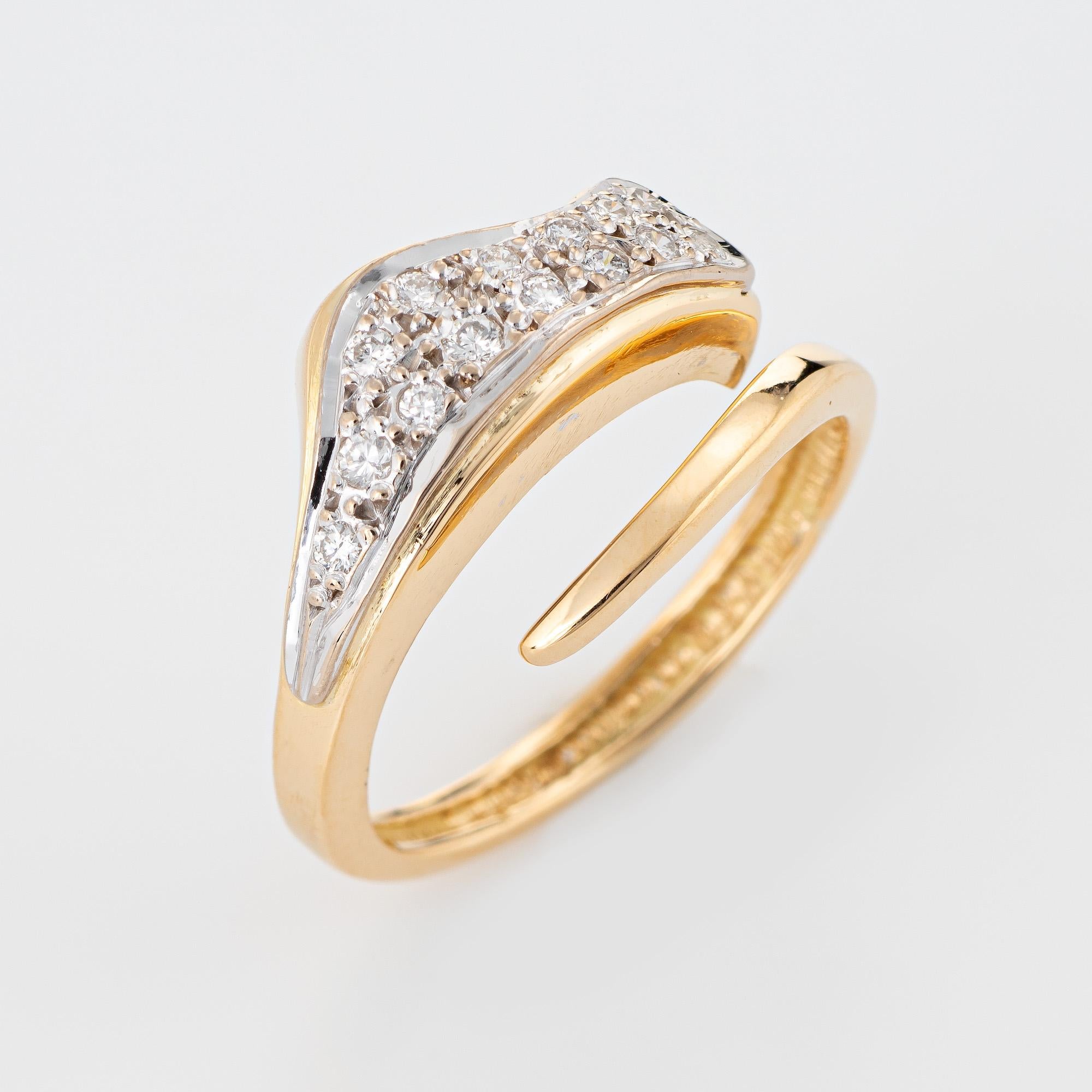 Stylish Ilias Lalaounis diamond band crafted in 18 karat yellow gold. 

Diamonds total an estimated 0.28 carats (estimated at H-I color and VS2-SI1 clarity). 

The stylish band features a bypass undulating design by the famed Greek designer Ilias