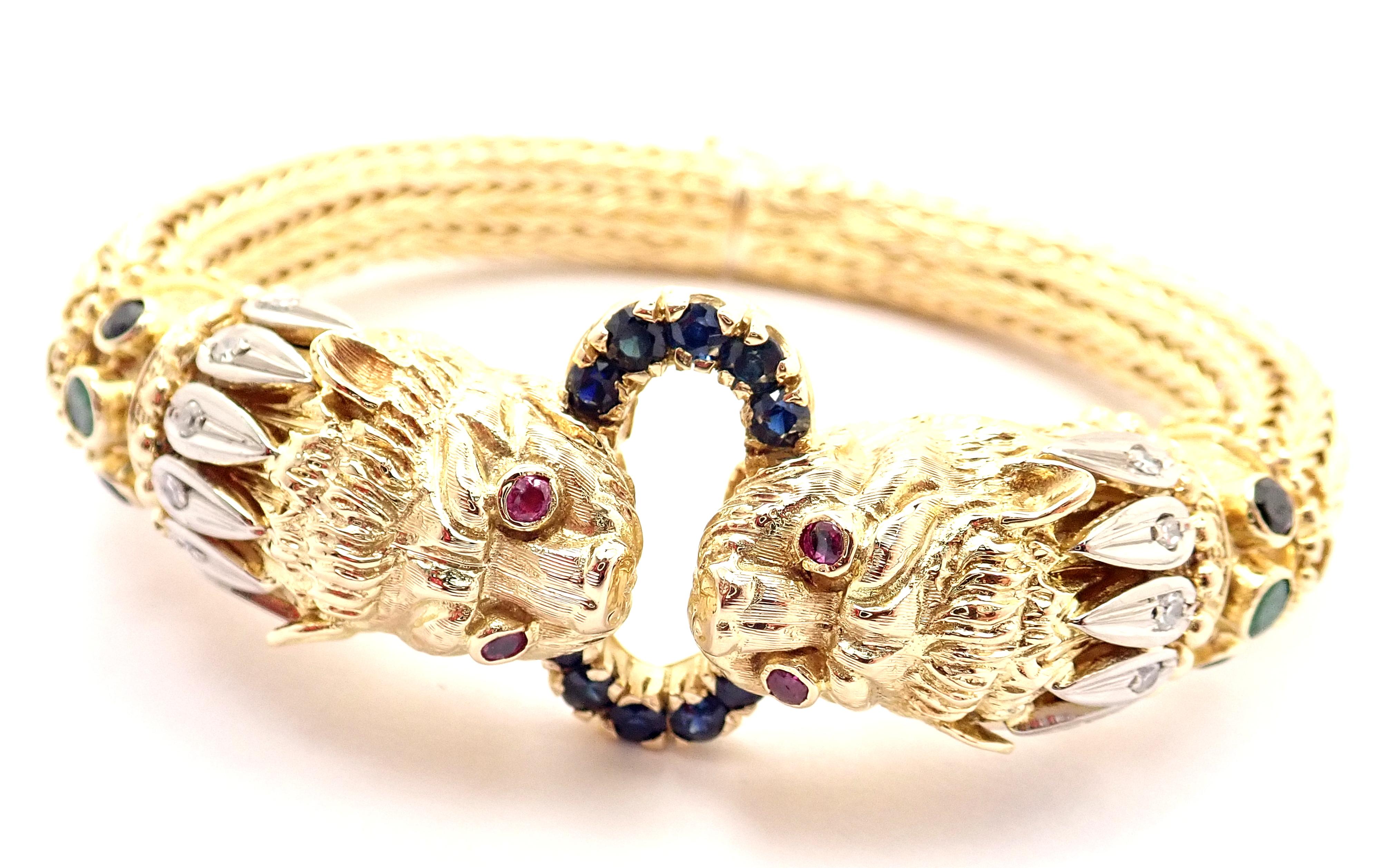 18k Yellow Diamond Ruby Sapphire Chimera Bangle Bracelet by Ilias LaLaounis. 
Made in Greece. 
With 12 round brilliant cut diamonds 
14 round sapphires
4 rubies
2 emeralds
Details: 
Length: Fits 7
