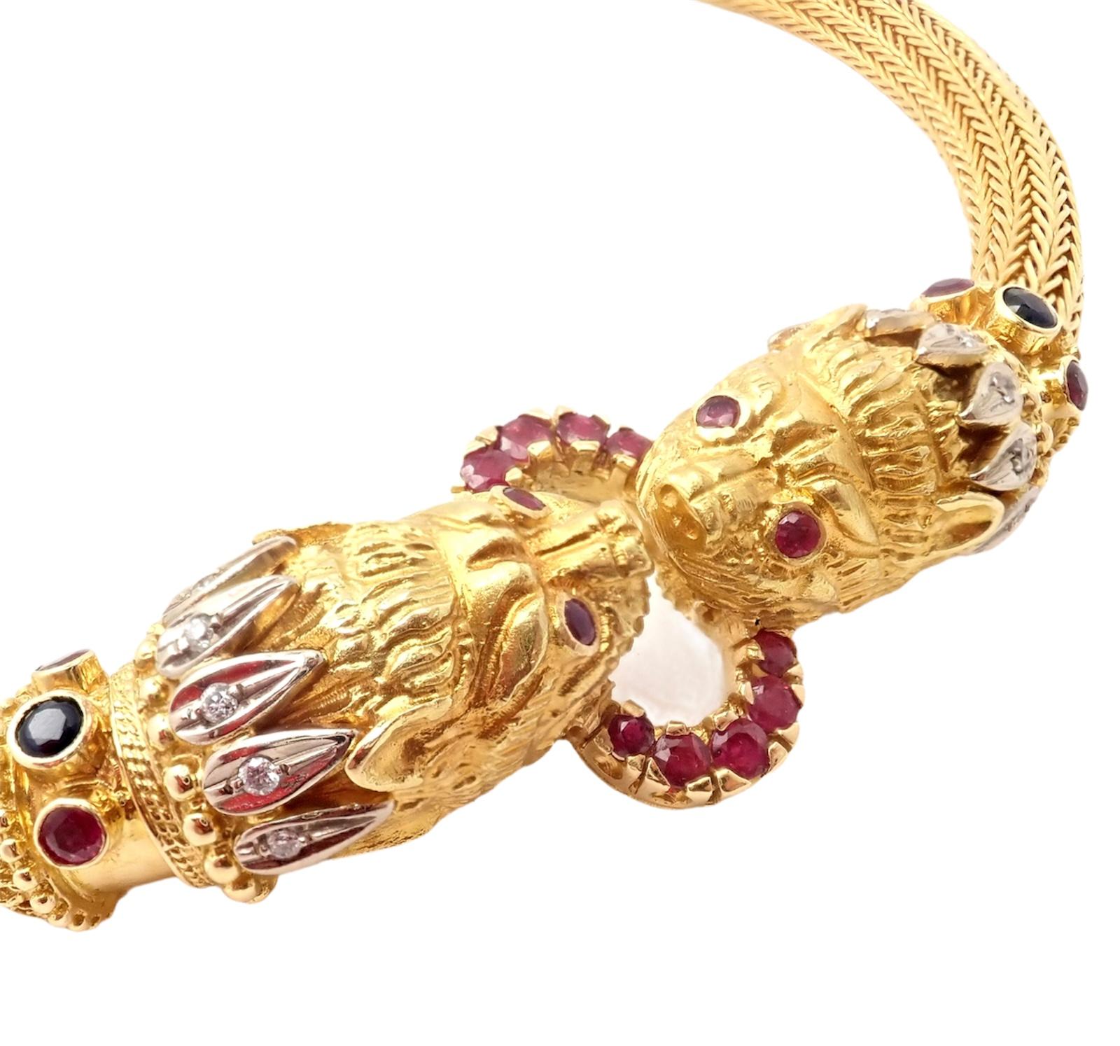 18k Yellow Gold Diamond Ruby Sapphire Chimera Collar Necklace by Ilias Lalaounis Greece.
With 2x Sapphires
12x Diamonds
18x Rubies
Details: 
Length 15.5