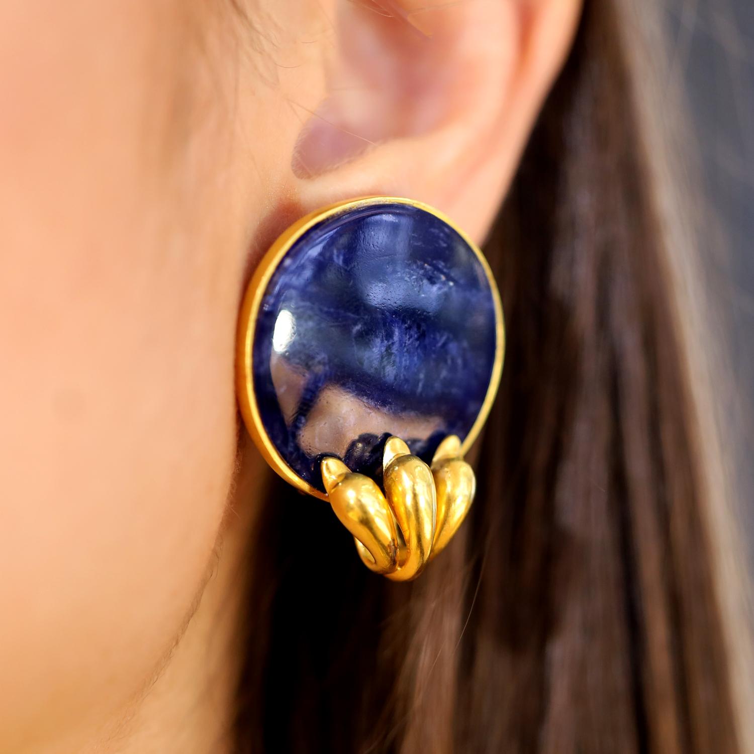 A fabulous example from famed Greek designer Ilias Lalaounis showcases these large, bold and fanciful 18k yellow gold sodalite earrings. Adorned with a trio of graceful swans, his designs evoke Hellenistic, Etruscan and Byzantine themes from ancient
