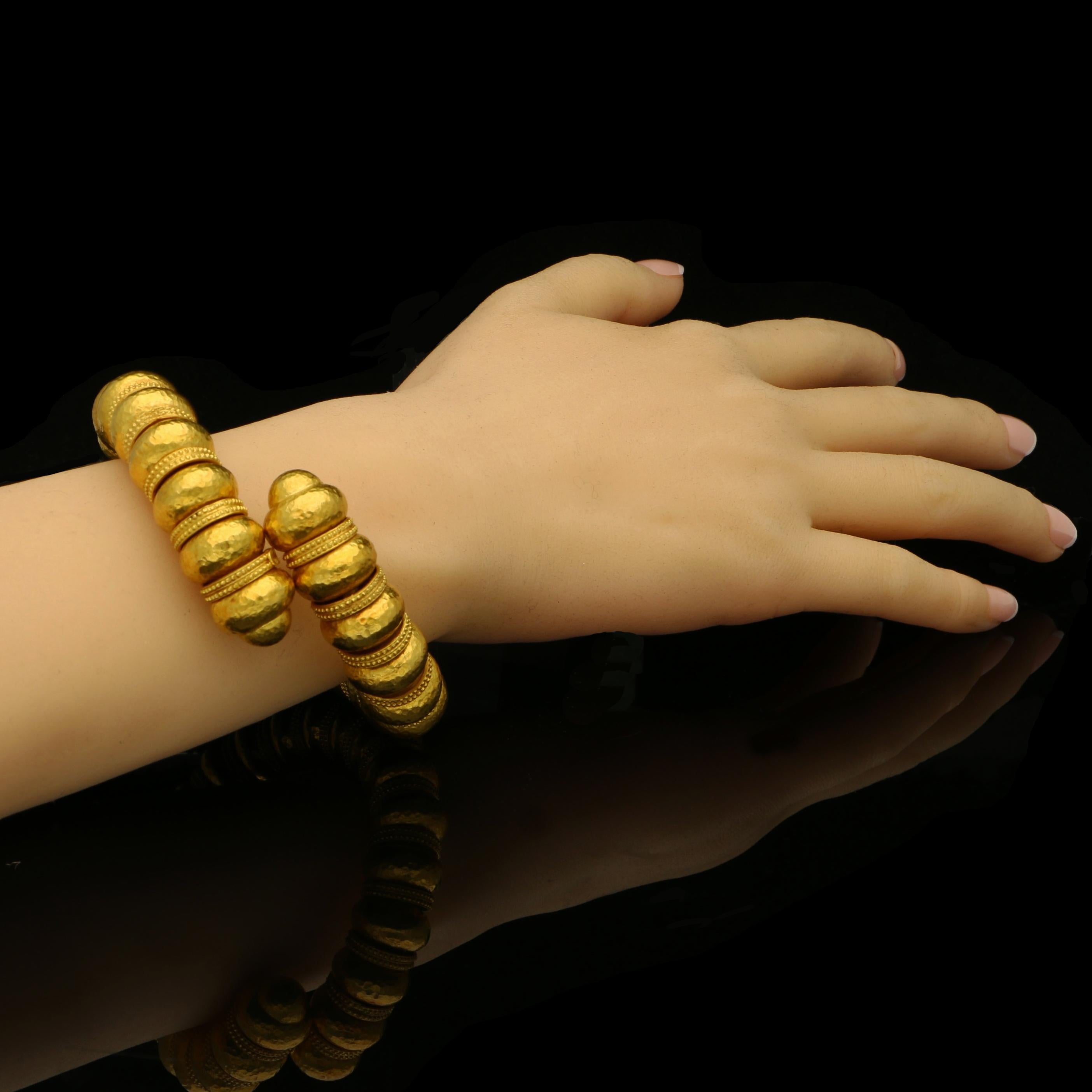 22ct yellow gold signed Ilias Lalaounis and with maker’s mark and K22
Inside wrist circumference 6.5”
129 grams

A stylish gold bead bracelet from the Minoan and Mycenaean collection by Ilias Lalaounis c.1970s, the open sprung bracelet designed as a