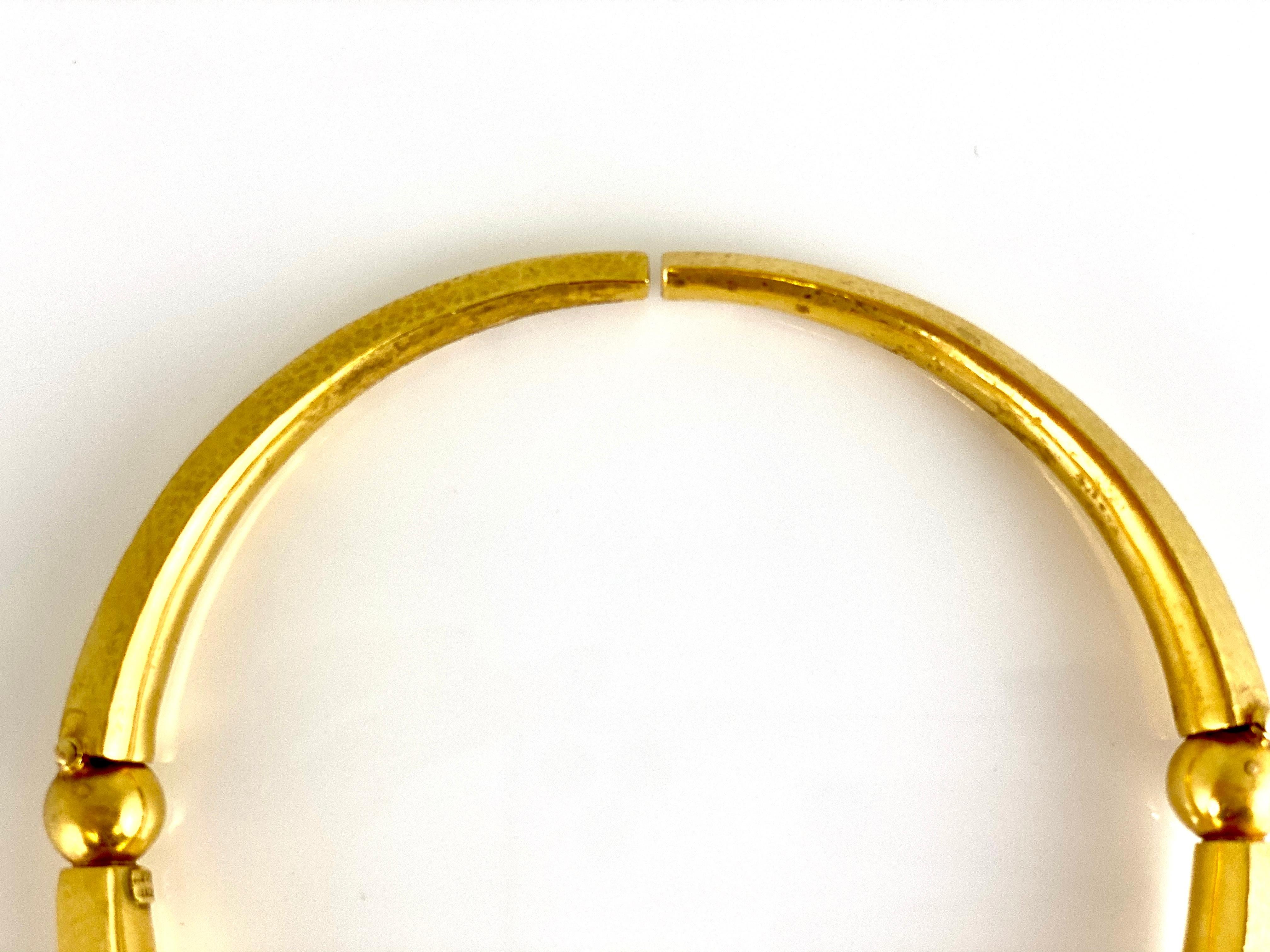 The choker is finely crafted in 22k yellow gold and weighing approximately total of 95.4 gram and 61.4 DWT.
15.5 inch.
Signed by Ilias Lalaounis.
