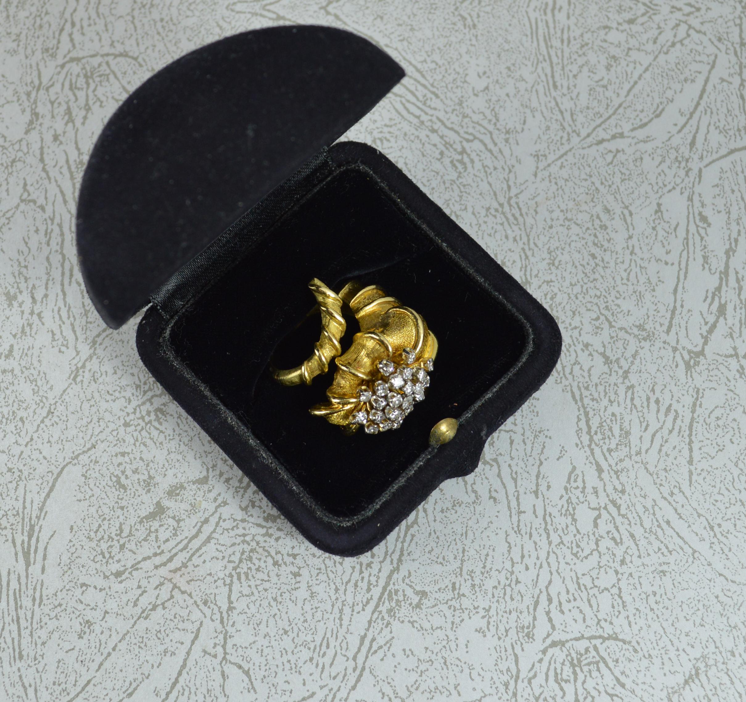 An impressive 18ct gold and diamond cluster ring by Ilias Lalaounis.
Solid 18 carat yellow gold example. Very heavy, weight piece.
Set with many round cut diamonds to front.
A striking natural shell type design. 25mm wide, protruding 16mm off the