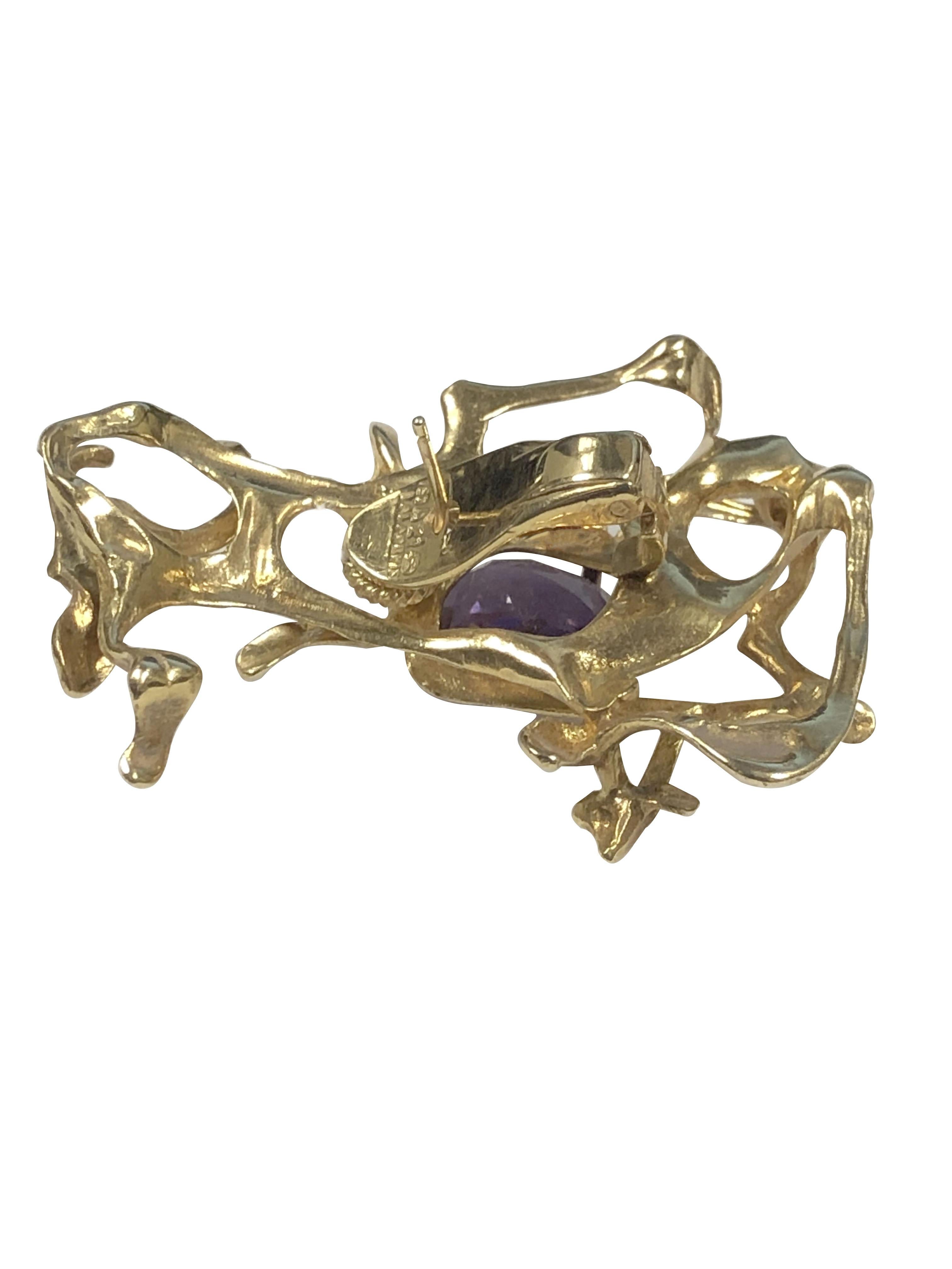 Circa 1970 Ilias LaLaounis Brutalist Free Form 18k yellow Gold Earrings, measuring 1 3/4 inches in length 1 1/8 inches wide and weighing 33.9 Grams. Centrally set with an oval Amethyst each approximately 4 Carats. Clip backs with a post, very