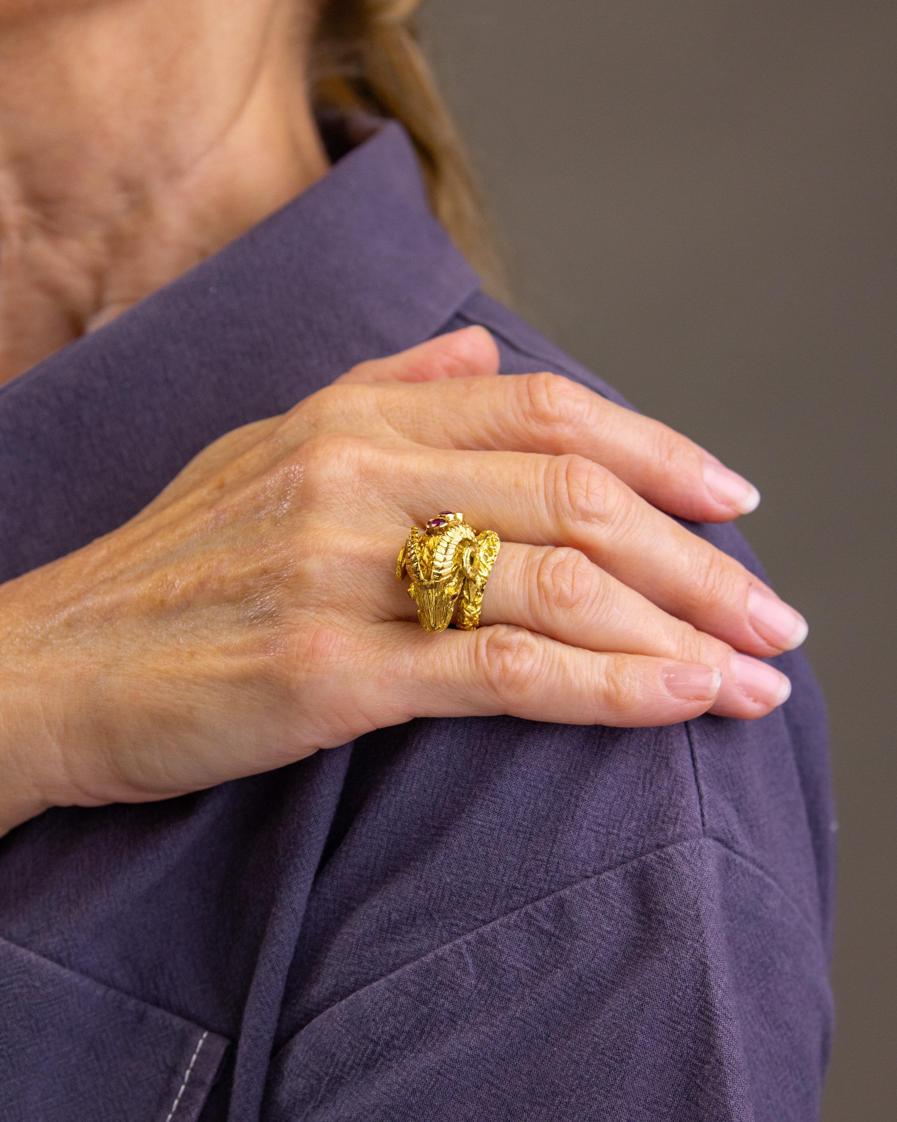 This sculpted rams head ring has been crafted from 18 karat yellow gold and is set with rubies. Manufactured by the leading Greek jeweller Ilias Lalaounis the piece is crafted in the Etruscan Revival taste which his workshop is widely known for. The