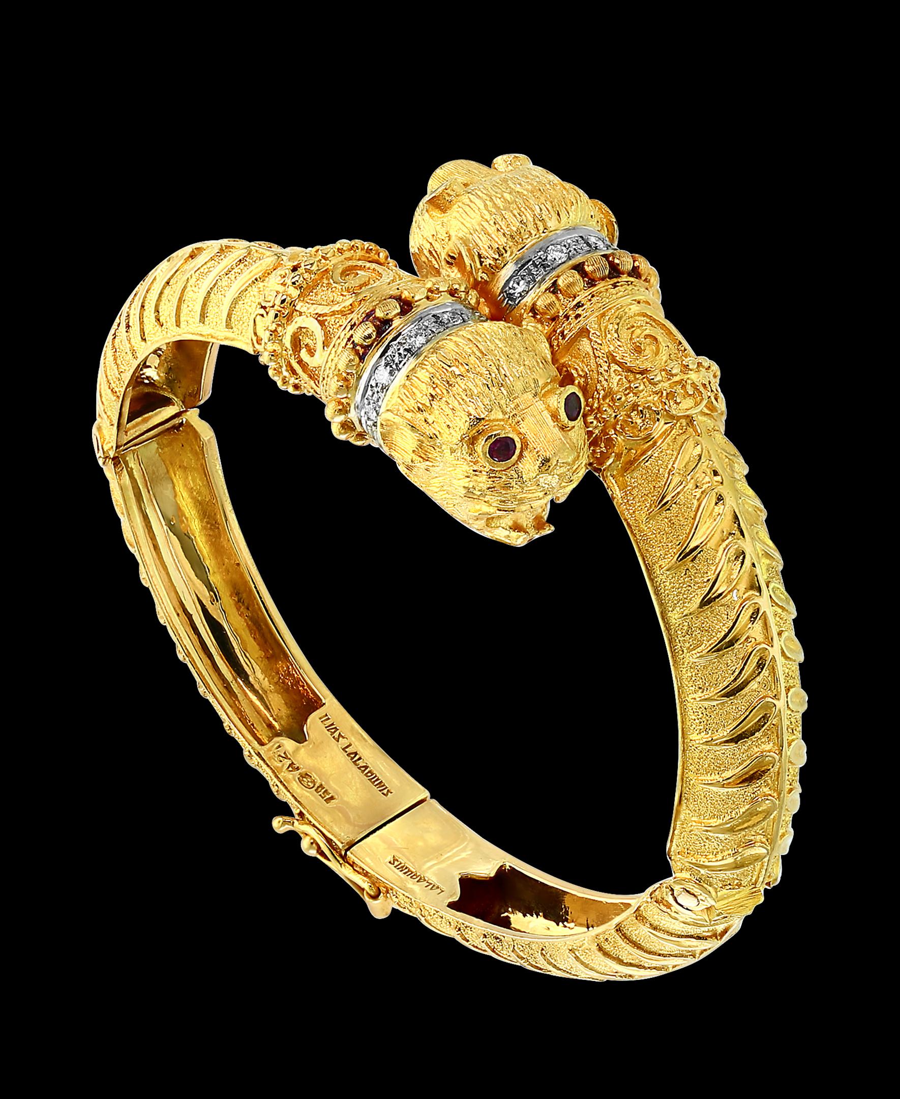 Ilias Lalaounis  Ruby & Diamond Chimera Bangle Bracelet 18 K Yellow Gold 57 Gram
It features a bangle style  Bracelet crafted from an 18  karat  Yellow gold and embedded with  Diamonds on the neck area  .
Eyes are made of brilliant Ruby.
Open from