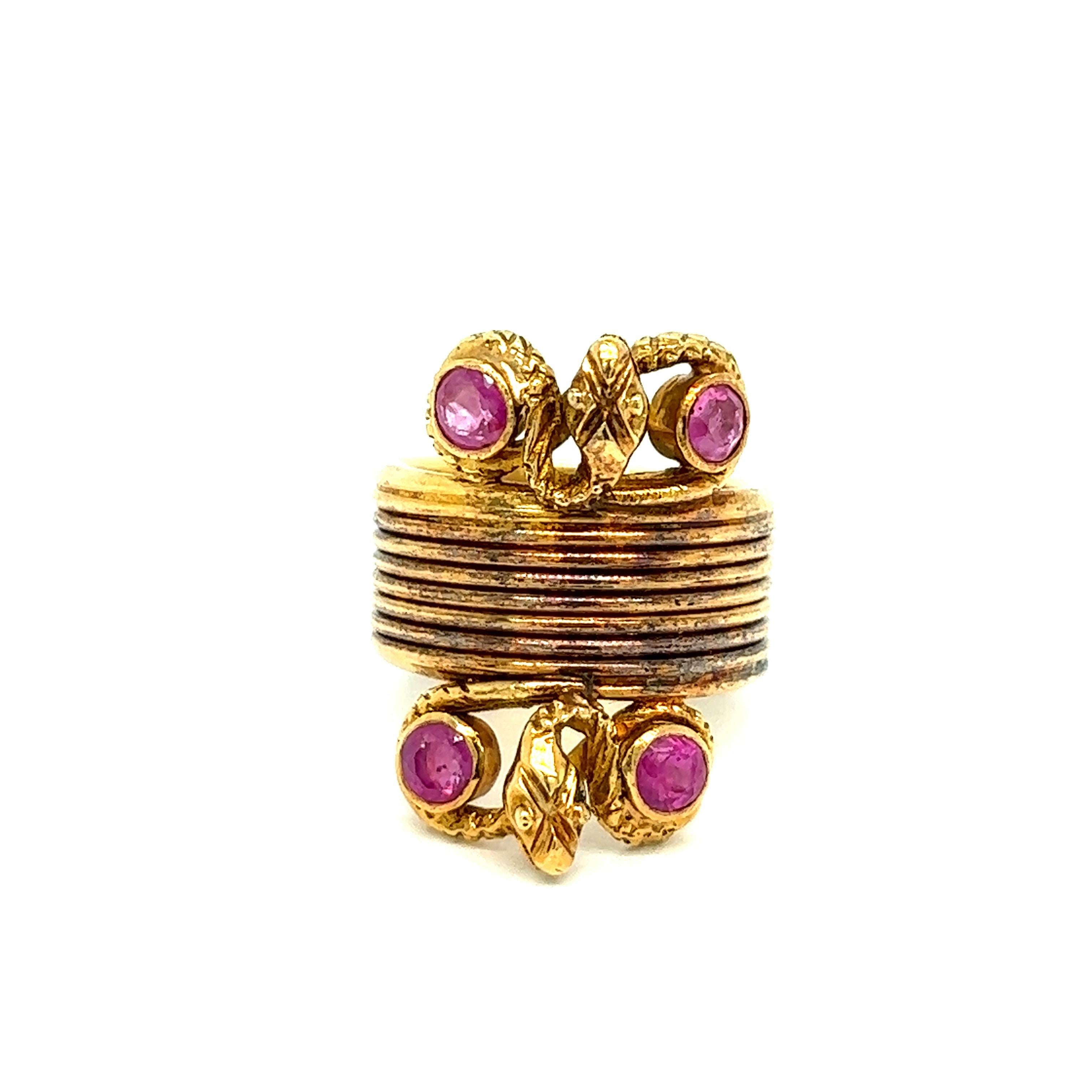 Ilias Lalaounis snake ruby gold ring 

Round-cut rubies of approximately 0.60 carat, 18 karat yellow gold, snakes motif; marked Ilias Lalaounis, A21

Size: 4.5 US
Total weight: 11.6 grams