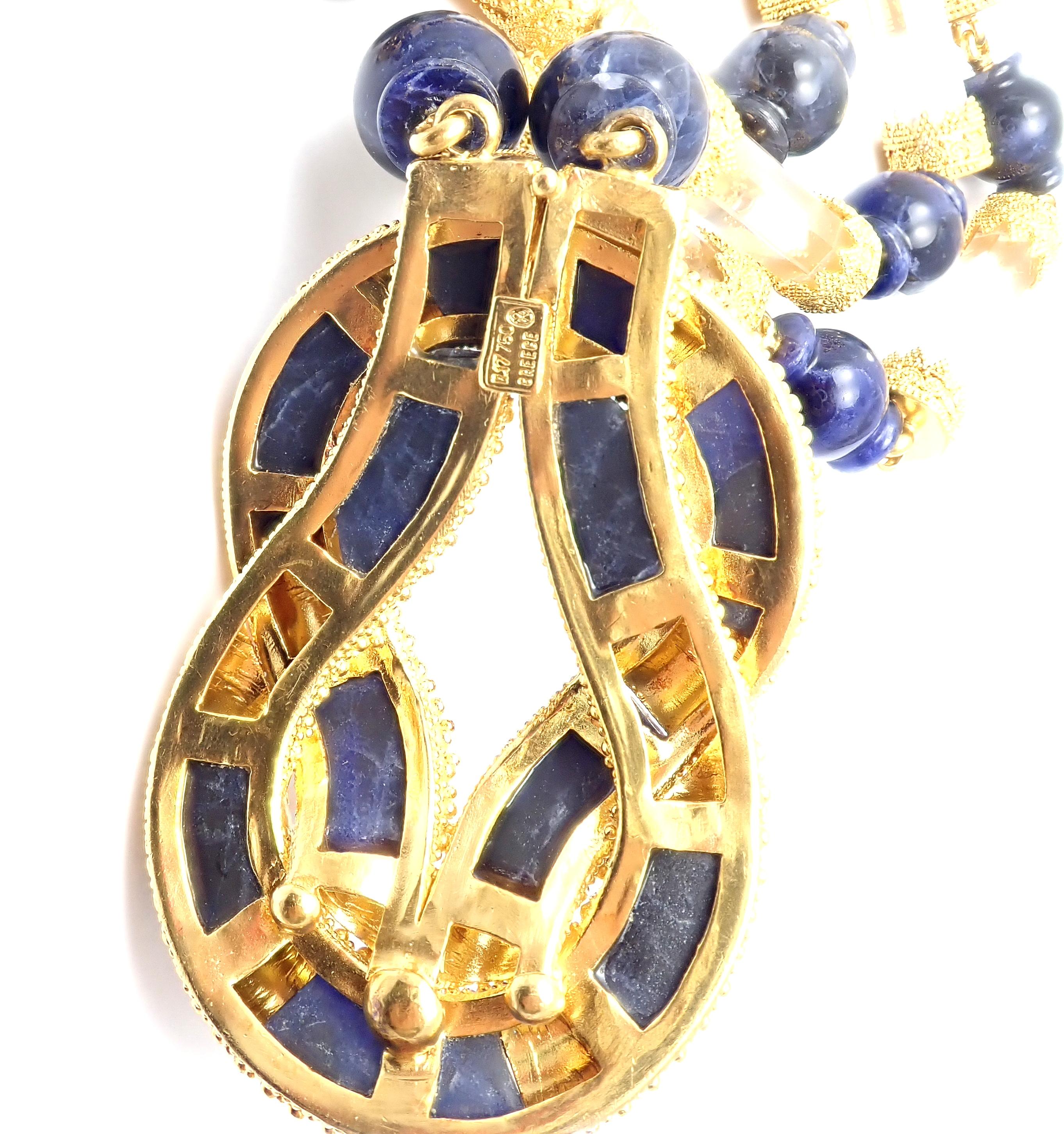 18k Yellow Gold Sodalite Rock Crystal Hercules Knot Necklace By Illias Lalaounis.
Details:
Length: 30