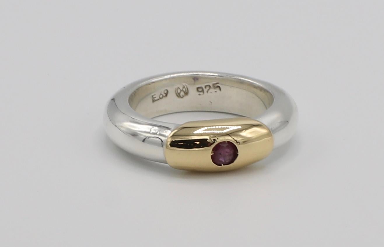 Ilias Lalaounis Sterling Silver & 18K Gold Ruby Stackable Band Ring Size 5

Metal: Sterling silver & 18k gold 
Weight: 7.28 grams
Size: 5 (US)
Band is 4.6mm wide 
Ruby is approx. .10 carats 

