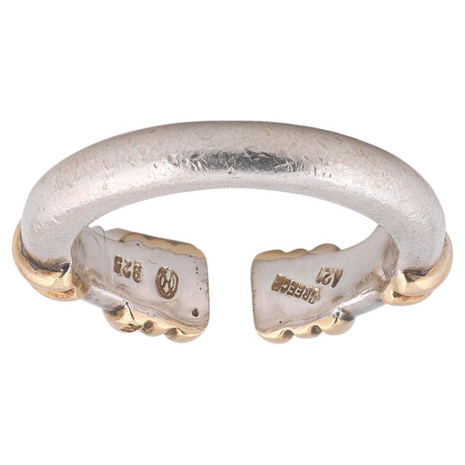

An Ilias Lalaounis sterling silver and 18K yellow gold cuff ring. This ring features a high polish sterling silver cuff body with beveled 18K yellow gold accents.
Size : 7
