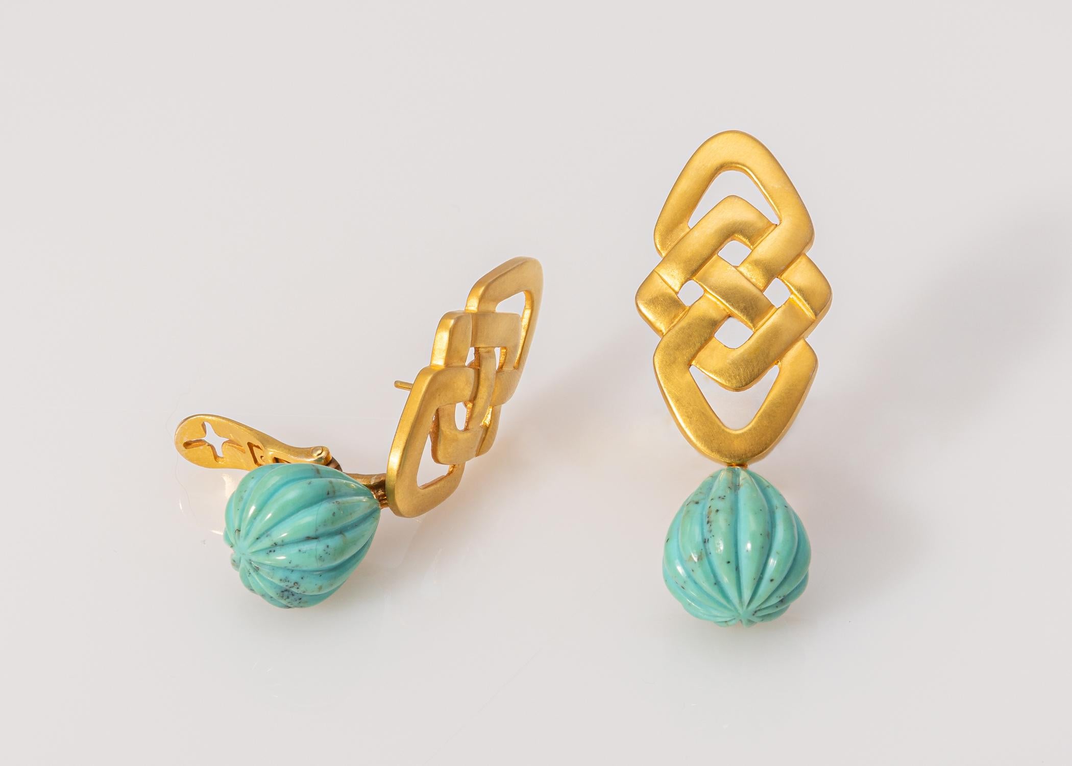 The knot motif is often seen in Lalaounis designs. This design features a pair of carved turquoise drops. If your not traveling to Greece bring it to you with this elegant pair of drop earrings. 2 inches in length.