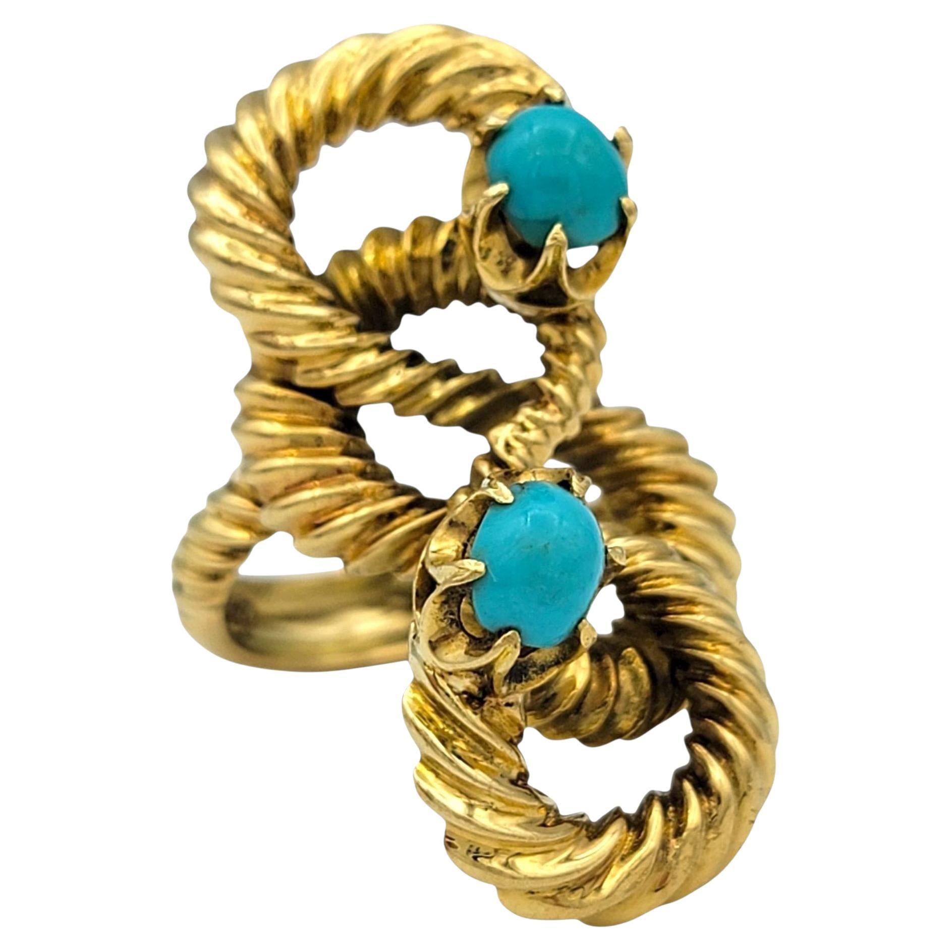 Ring Size: 8

This bold and sculptural ring by Ilias Lalaounis celebrates ancient Greek design with a modern twist. Crafted in 18 karat yellow gold, it features a dramatic double rope motif that coils in a fluid figure-eight shape. Nestled within