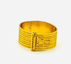 Ilias Lalaounis "Wrap" ribbed ring in 22k yellow gold
