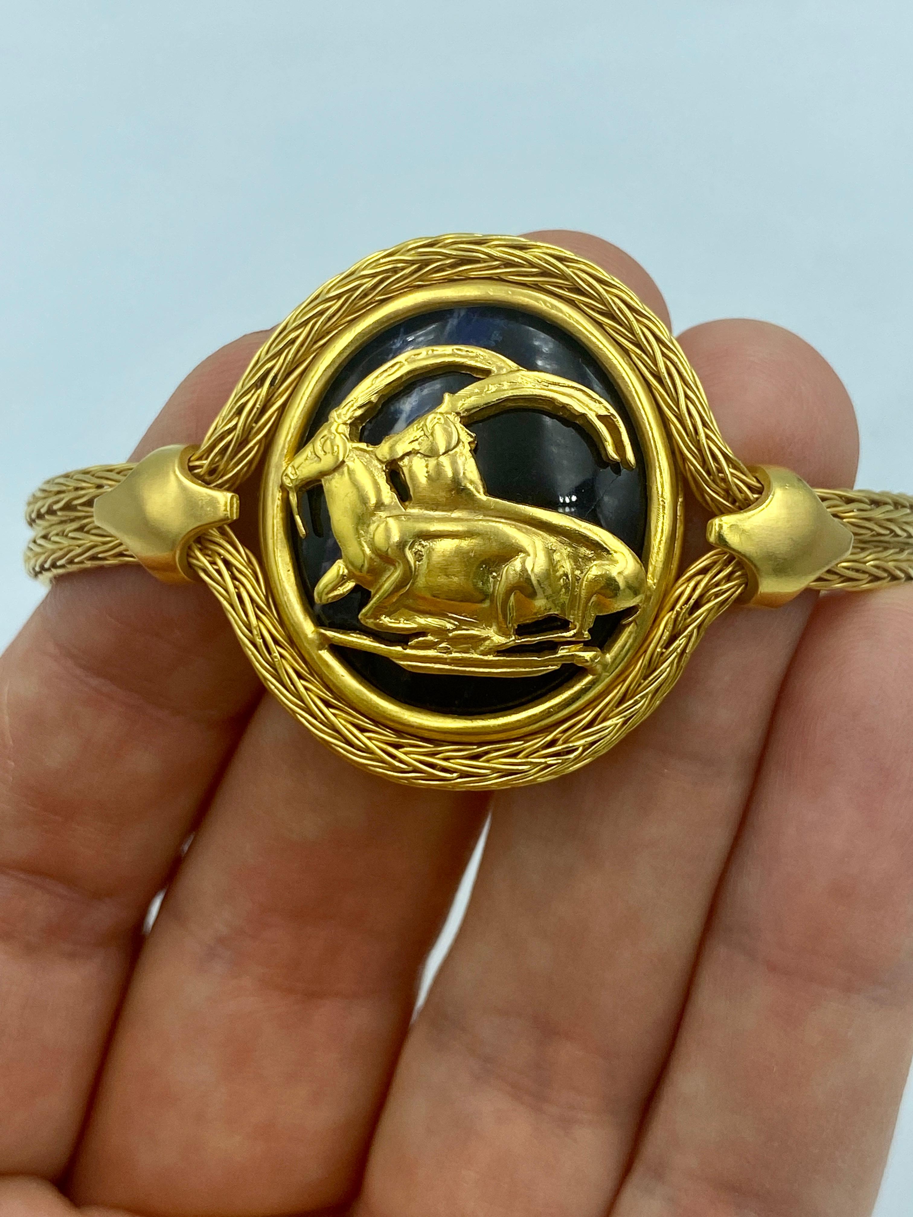 Cabochon Ilias Lalounis 18k gold and lapis lazuli bracelet with mountain goat design For Sale