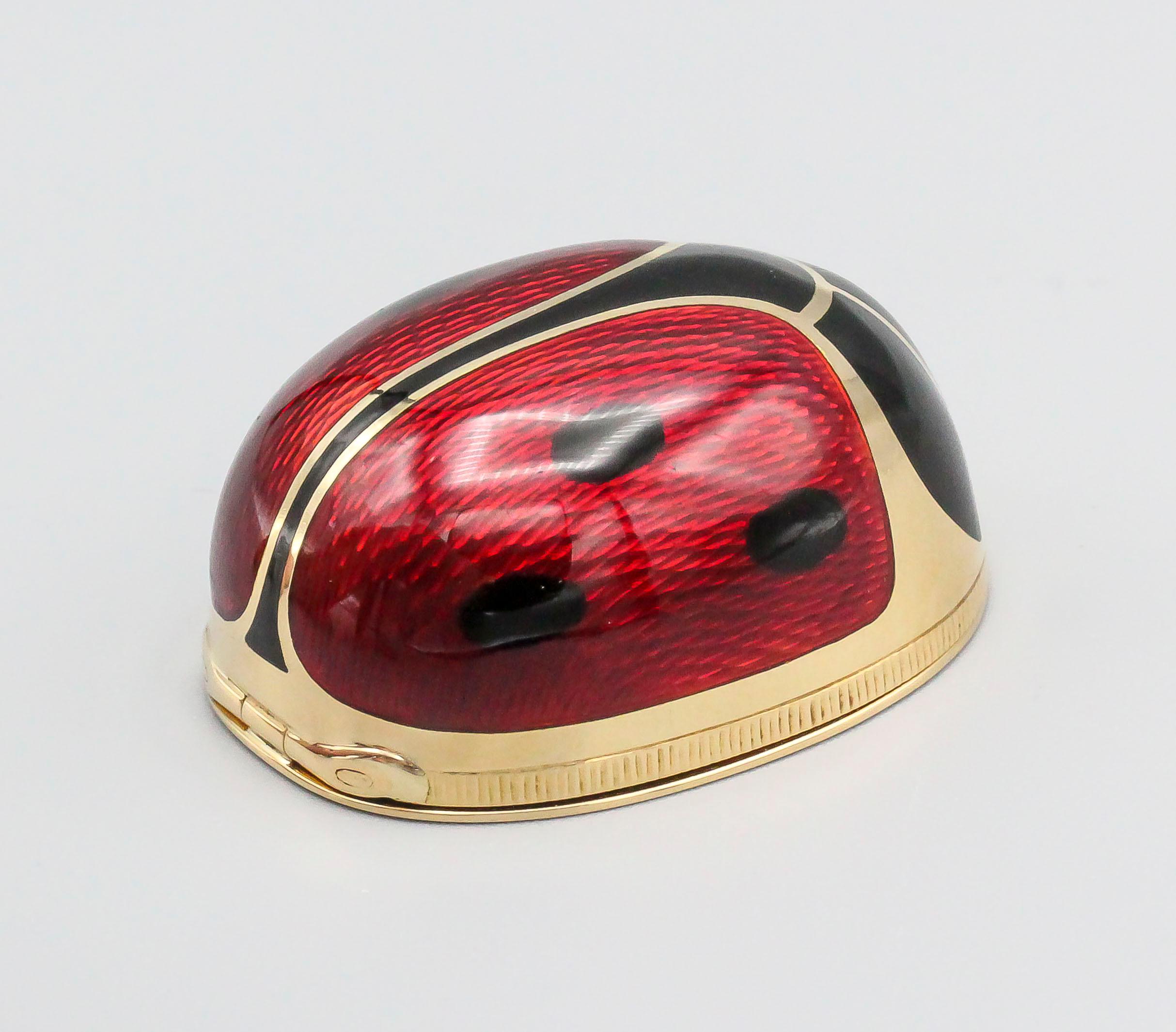 Whimsical white, red and black enamel over 18K yellow gold pill box resembling a ladybug by Carlo Illario Brothers.  Known for their work with Bulgari, they are expert goldsmiths and applications in enamel.

Hallmarks: CIF (Carlo Ilario Fratelli),