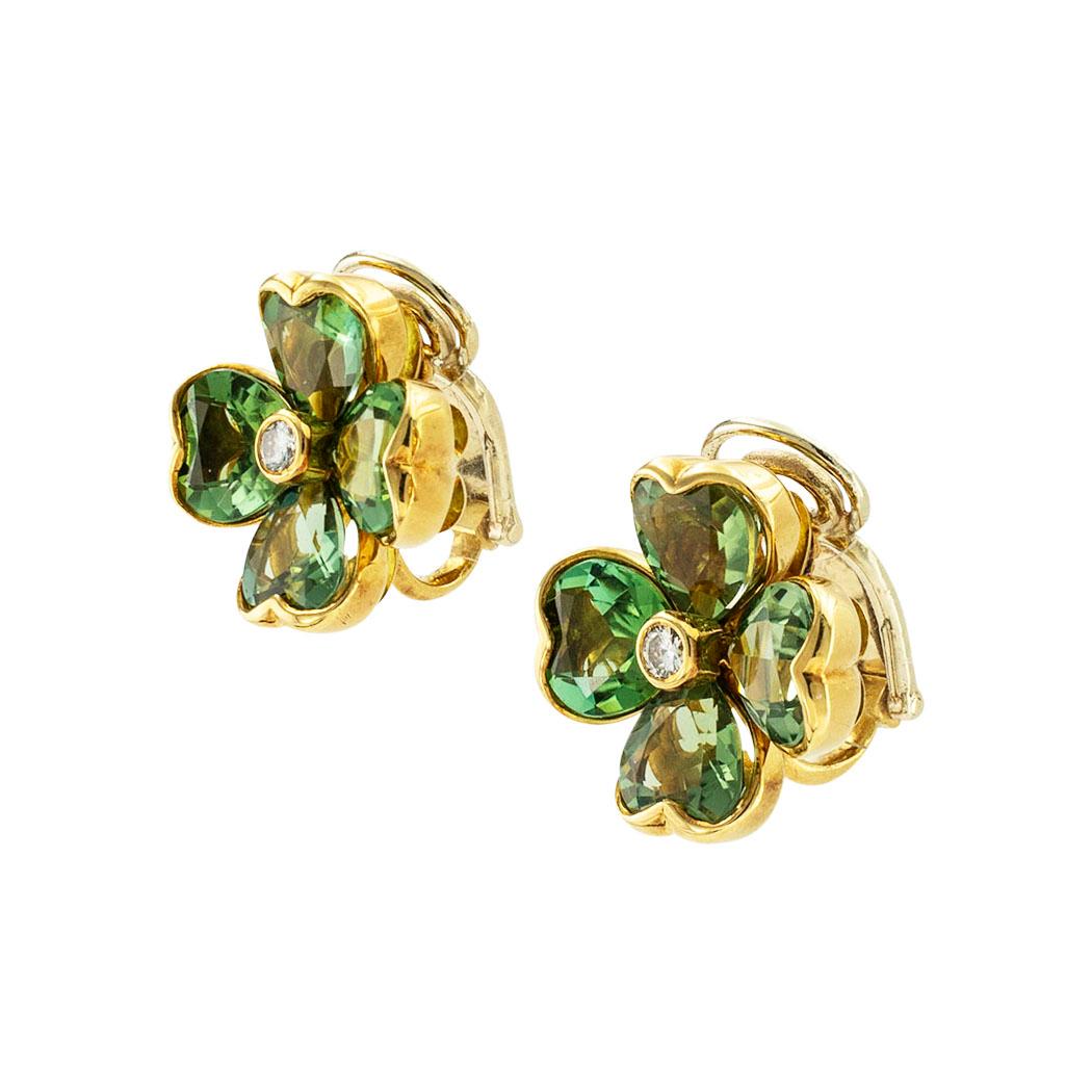 Illiario Green tourmaline and diamond four-leaf clover yellow gold clip-on earrings circa 1980. *

ABOUT THIS ITEM: #E-DJ27J. Scroll down for detailed specifications. These earrings were designed by Illario and the heart-shaped green tourmalines