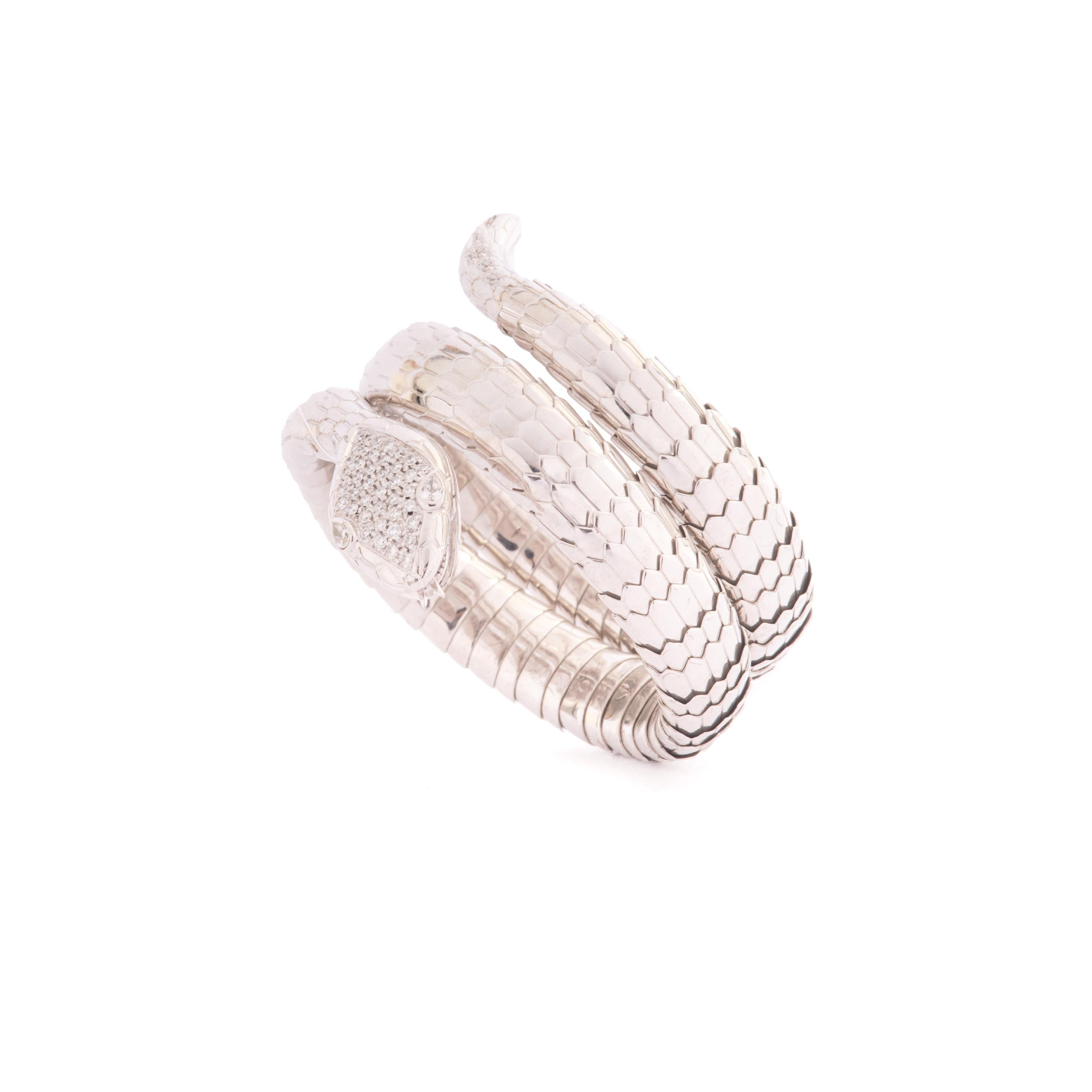 This Stylish extendable Illario white silver  and Diamonds Bracelet wraps around the wrist twice  
The Bracelet is excepionally crafted in 925 silver  with pavé Diamond on the head ct 0,18 and on the tail and Brilliant Navette-cut eyes ct. 0,77
 The