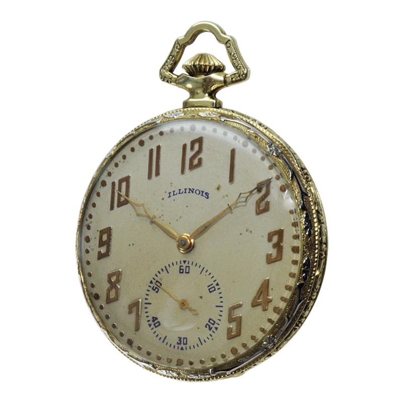 FACTORY / HOUSE: Illinois Watch Company 
STYLE / REFERENCE: Open Faced / Multi Colored Applique / Pocket Watch
METAL / MATERIAL: Yellow and White Gold Heavy Gold Filled 
CIRCA / YEAR: 1922
DIMENSIONS / SIZE: Diameter 44mm
MOVEMENT / CALIBER: Manual