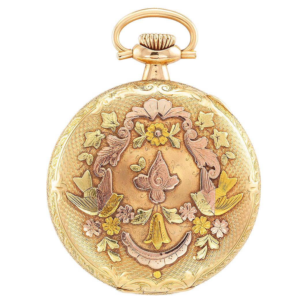 Antique Illinois hunter case tricolor 14 karat gold pocket watch circa 1919.  Both covers lavishly decorated with a basket weave pattern centering shields framed by a pair of finches balanced by scrolling foliar motifs, including floral sprays,